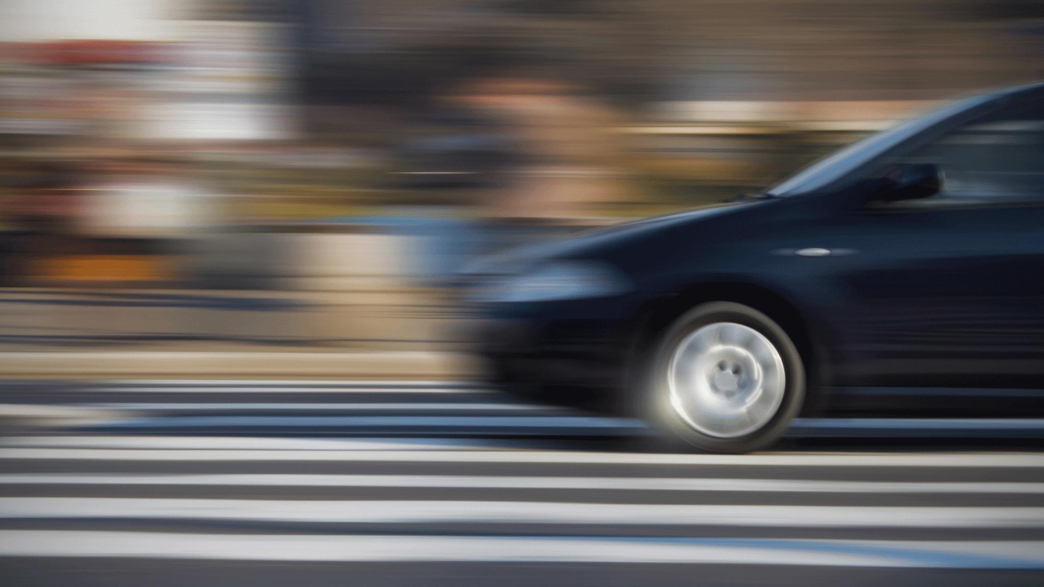 Car blurred on road