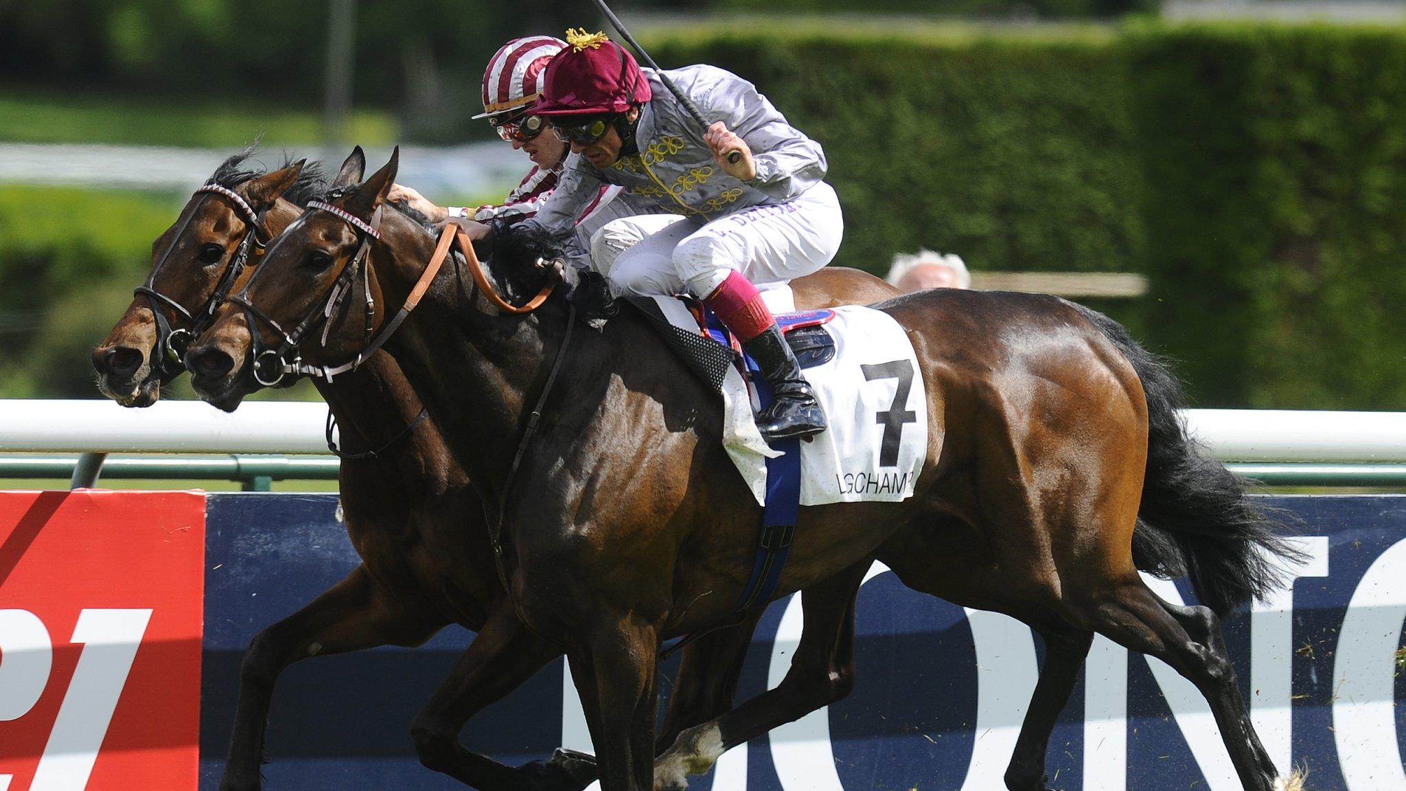 Christophe Soumillon riding Cirrus Des Aigles (L) win The Prix Ganay from Treve and Frankie Dettori