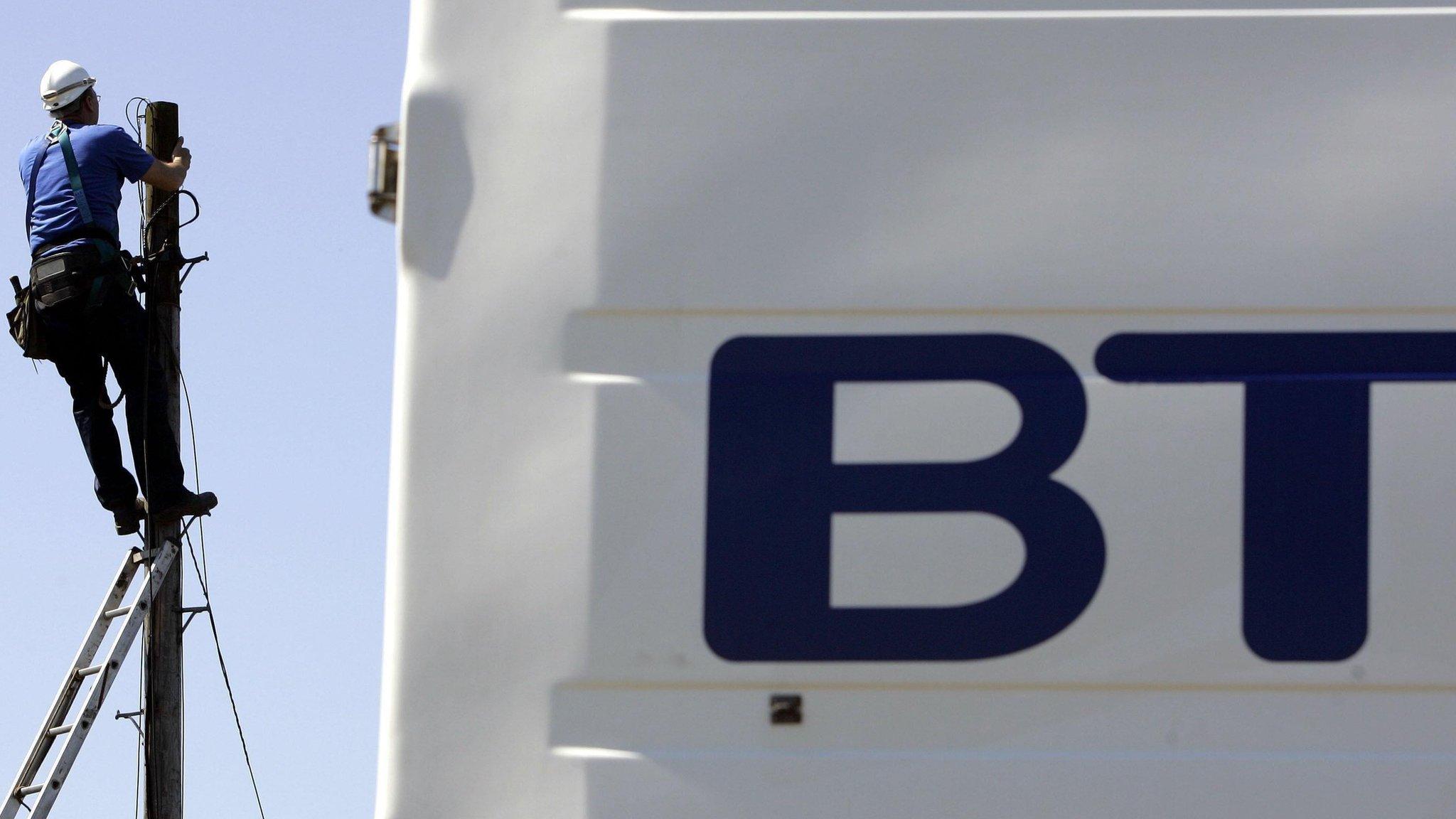 BT engineer on telegraph pole with BT van and logo in forefront of the image