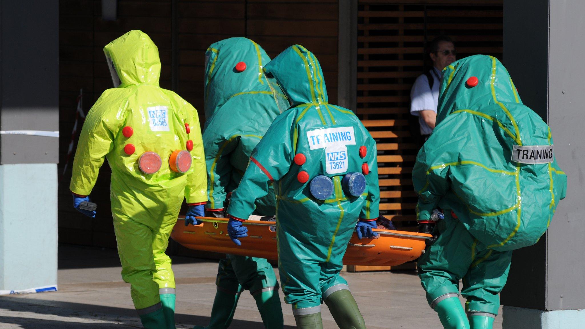 People in chemical protection suits