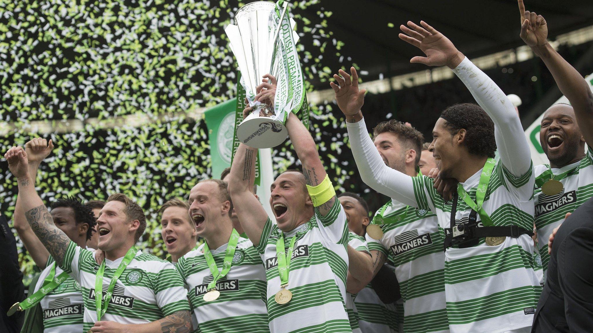 Celtic players celebrating with the Scottish Premiership trophy