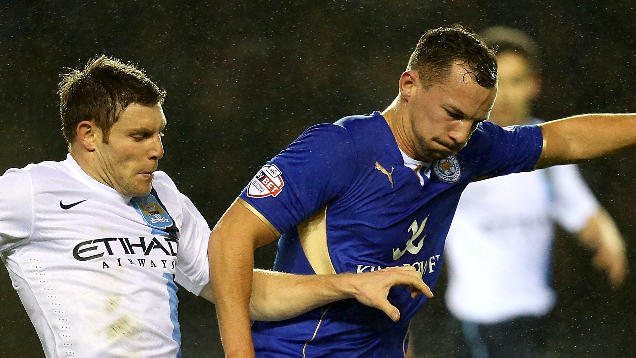 Leicester City's Danny Drinkwater (right) and Manchester City's James Milner (left) battle for the ball.