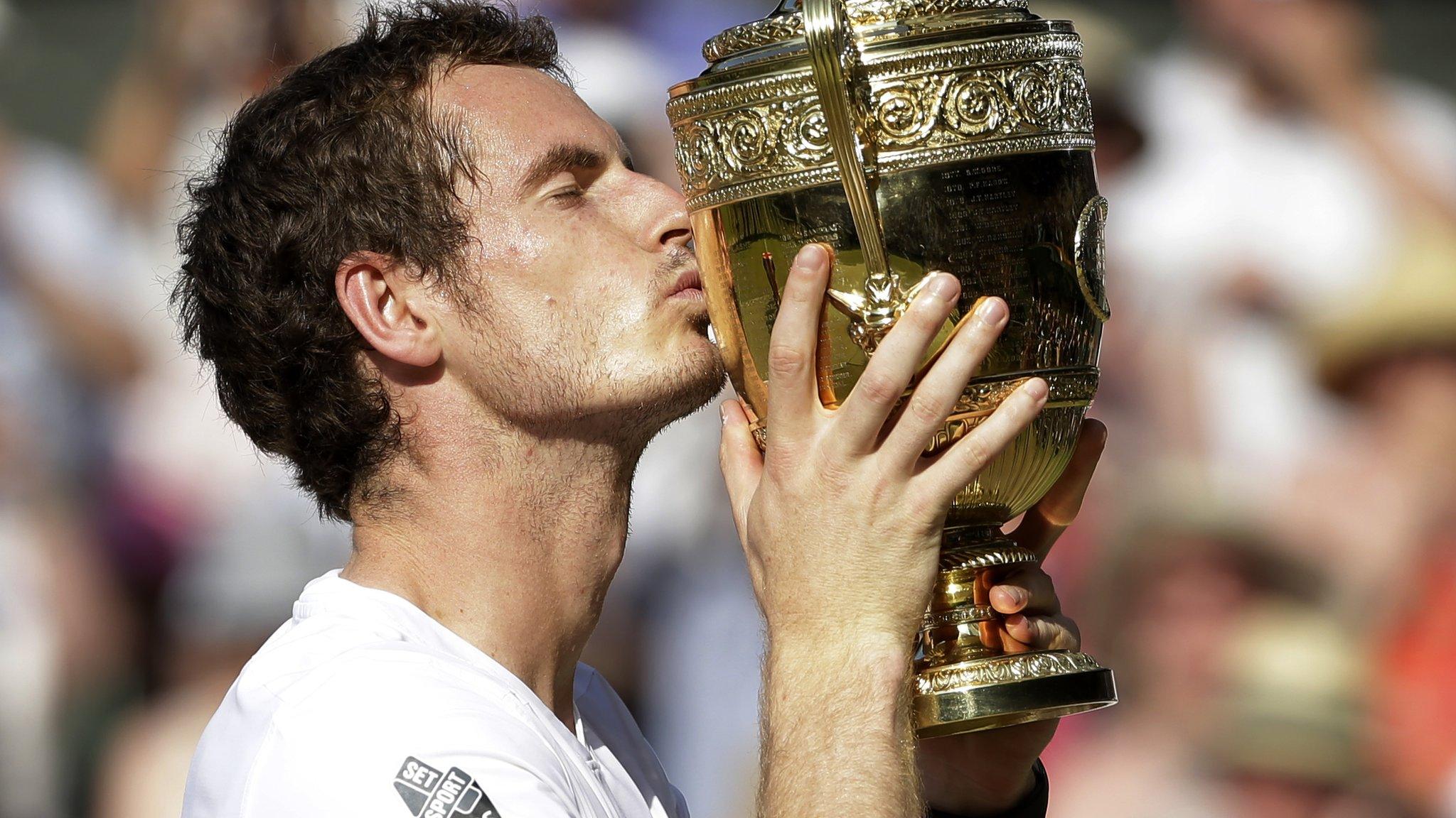 Andy Murray holding the trophy after winning Wimbledon in 2013