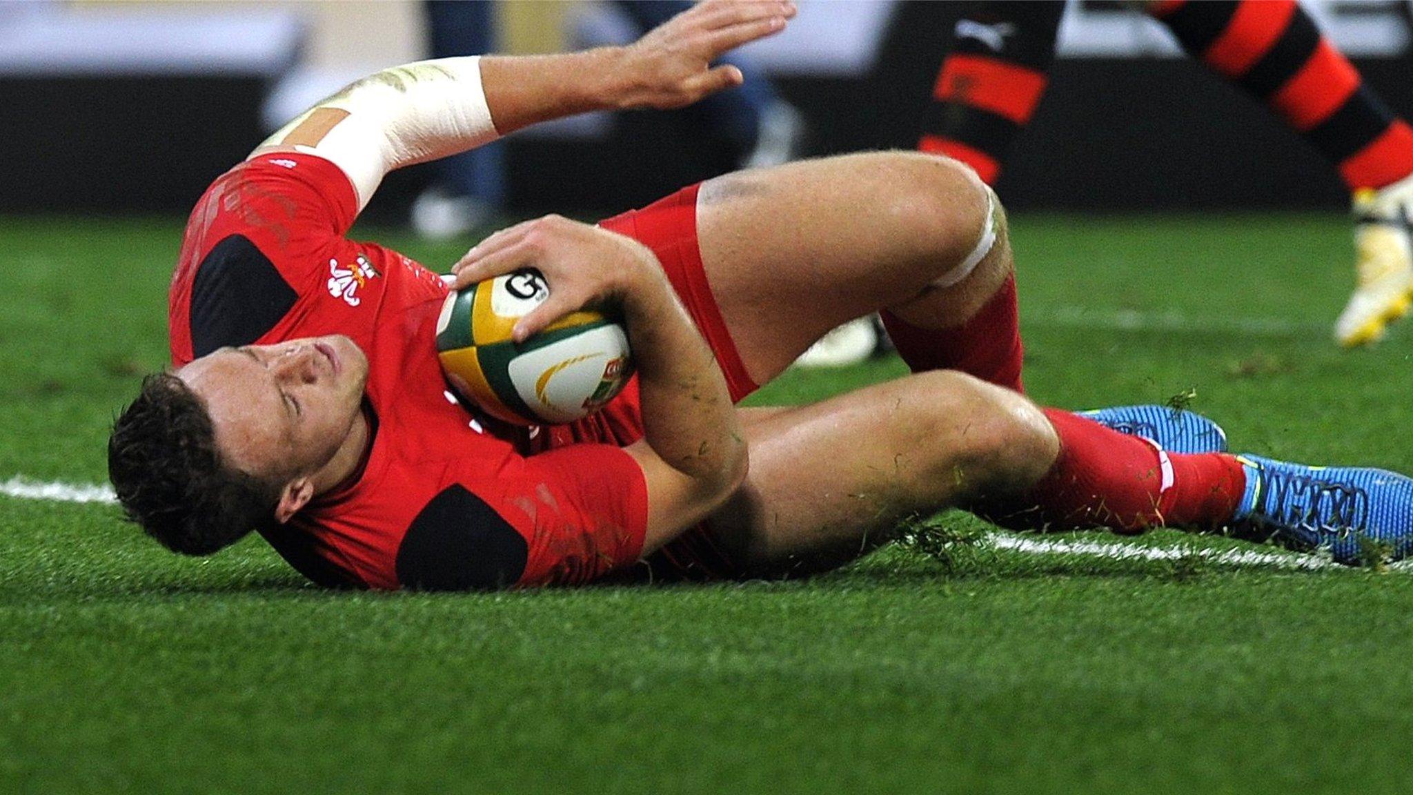 Corey Allen of Wales scores a try