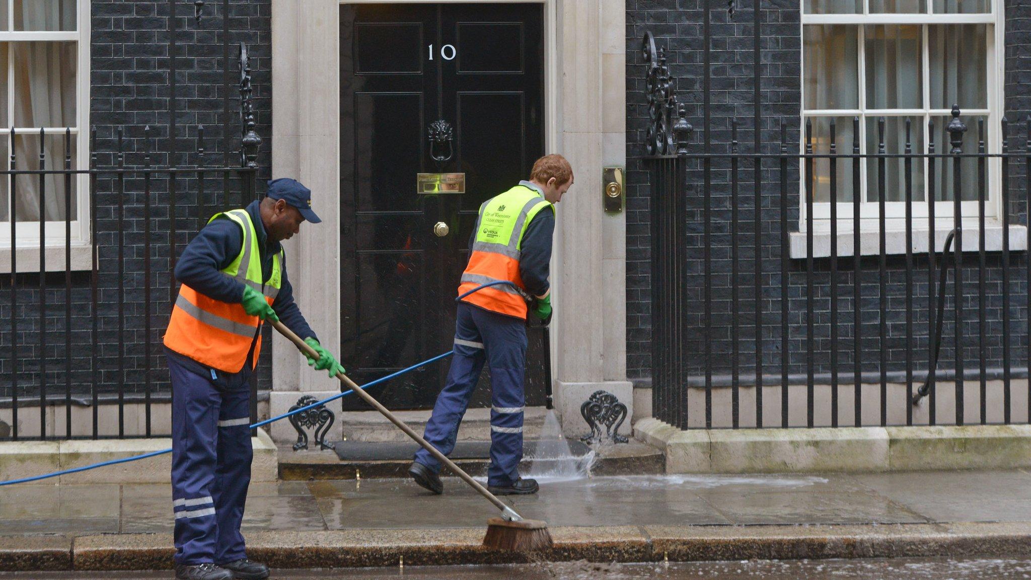 Cleaners outside 10 Downing Street