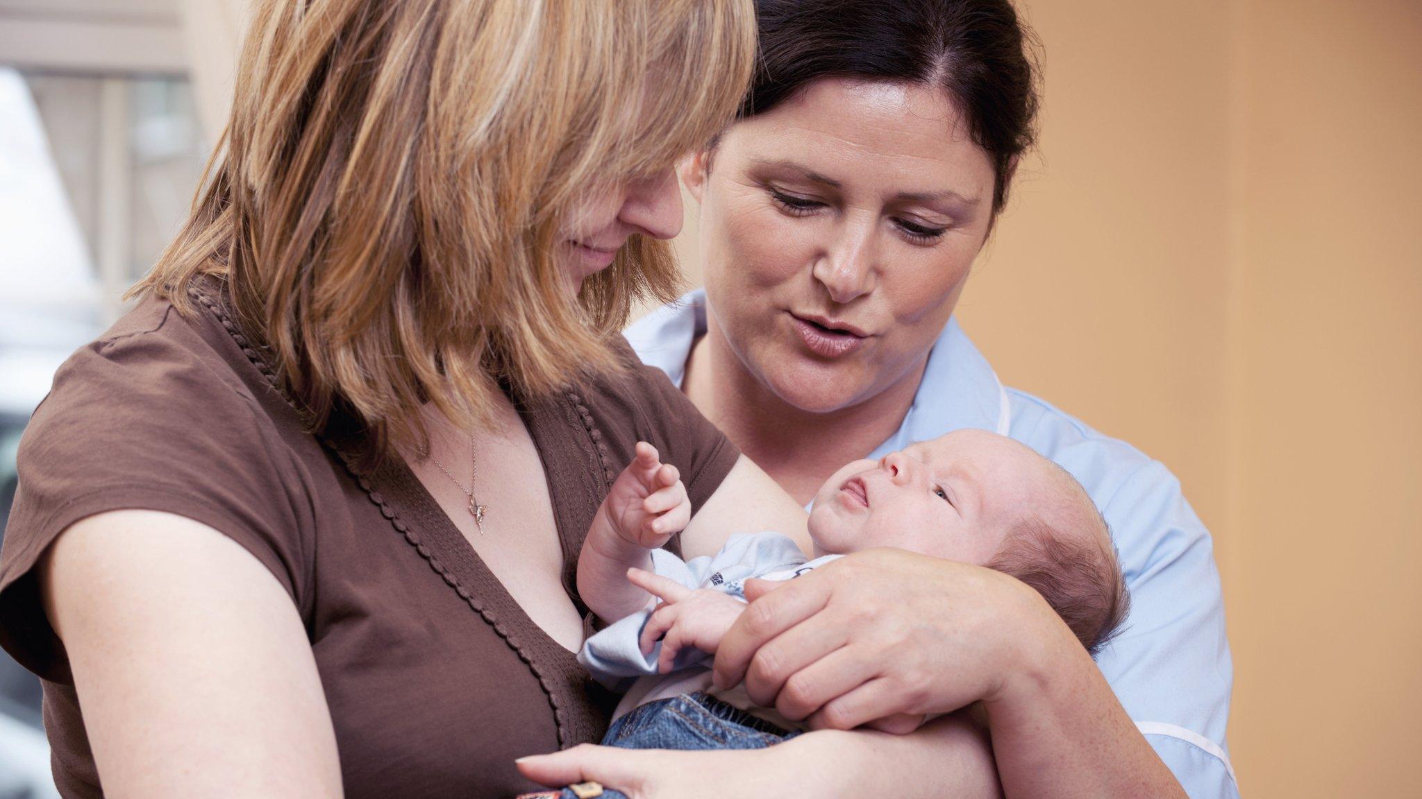 Mum, baby and widwife