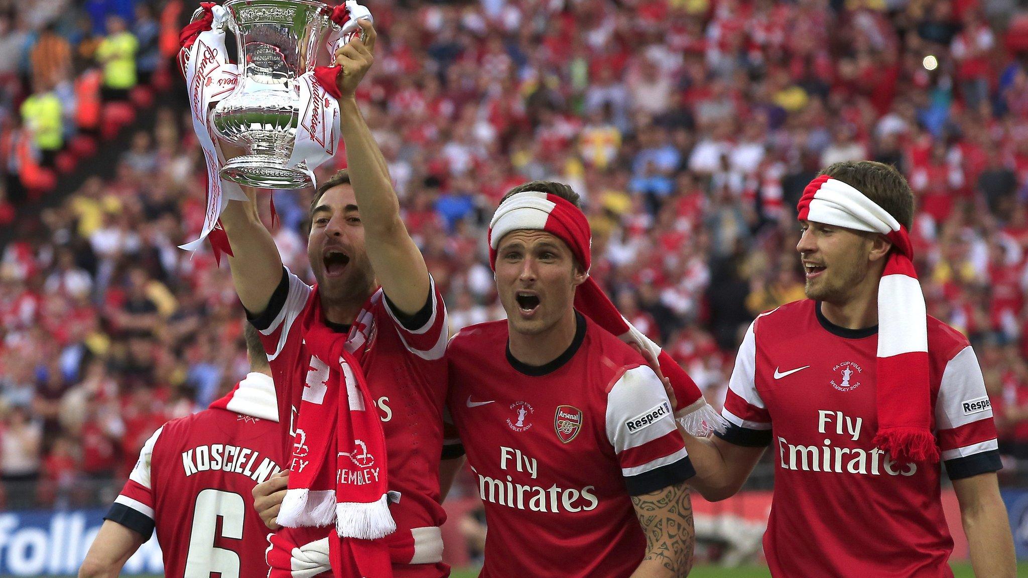 Arsenal players lift the 2104 FA Cup