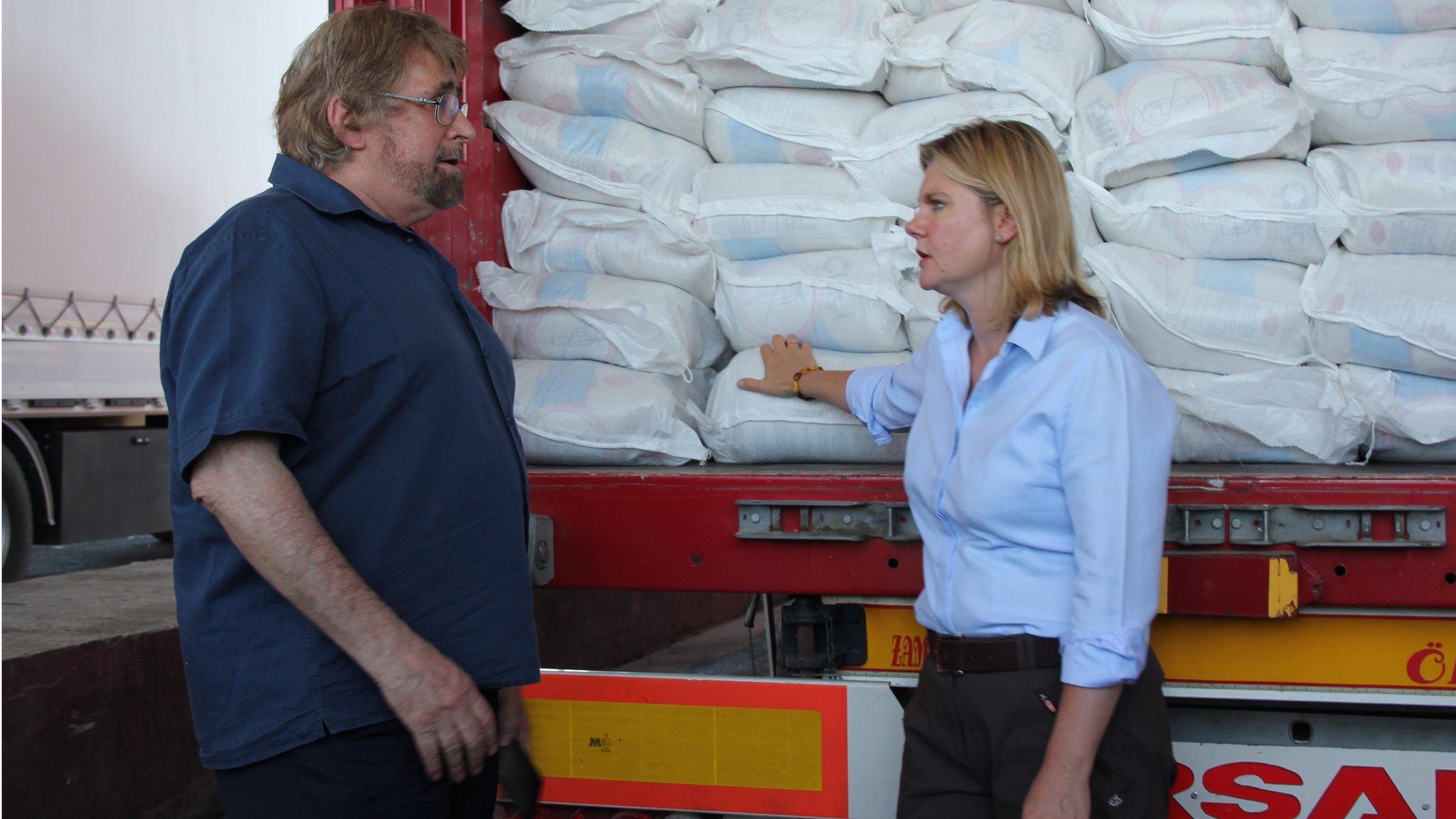 Justine Greening and a Mercy Corps member