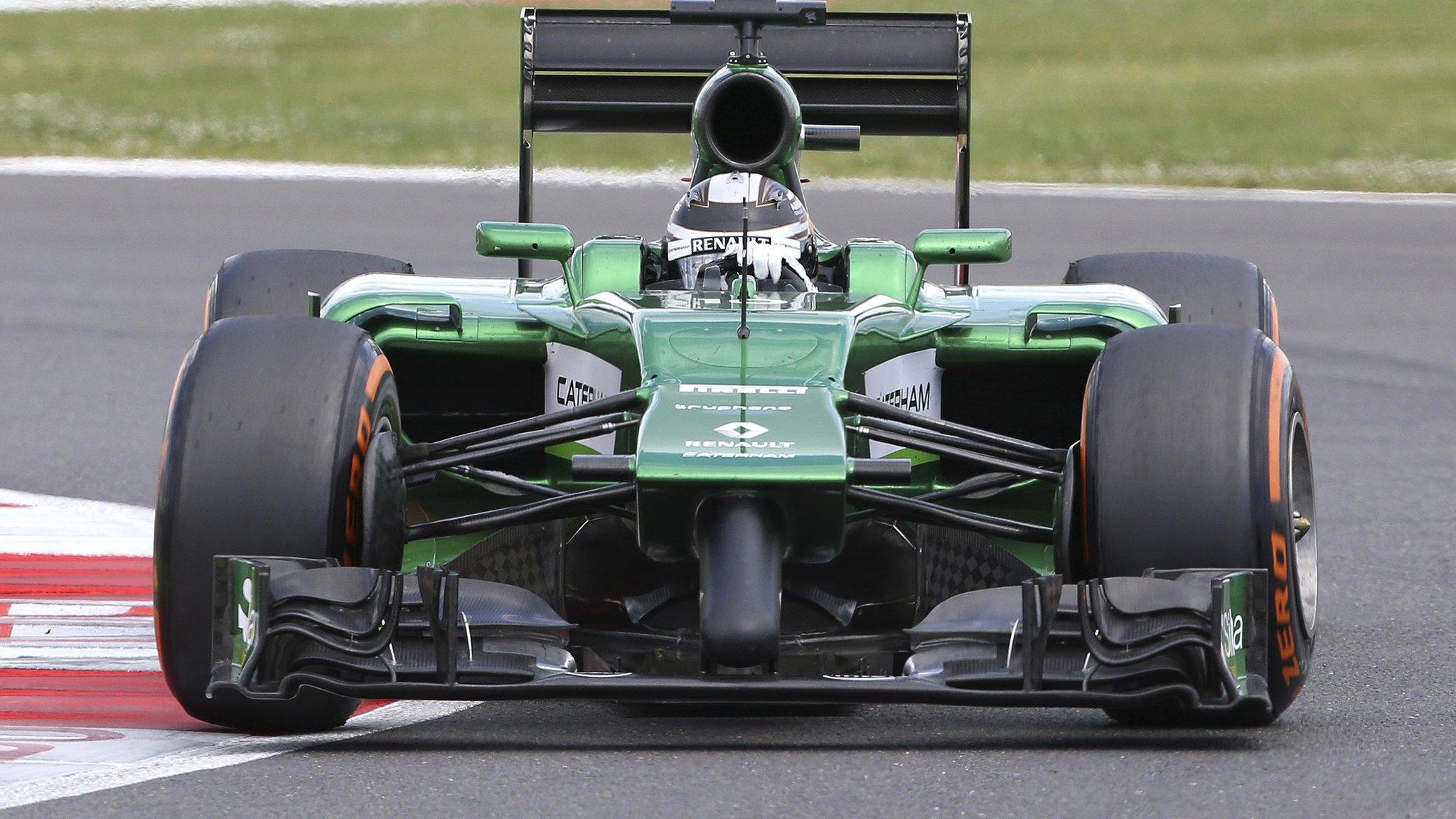 Caterham's F1 driver Kamui Kobayashi in action during the British Grand Prix