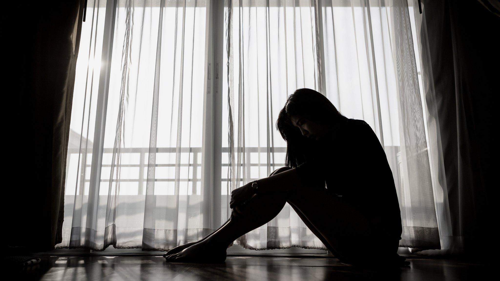 Woman sitting alone