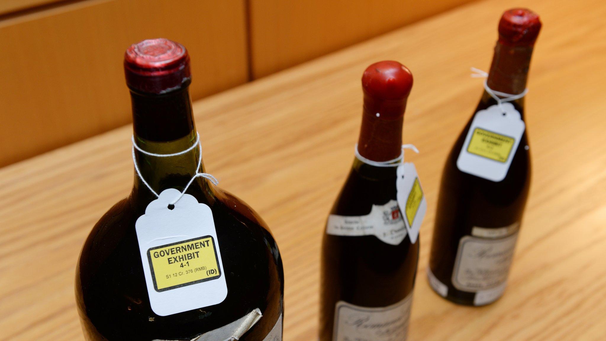 Three bottles of wine used as evidence in the trial of wine dealer Rudy Kurniawan are displayed in Federal Court in New York on 19 December 2013