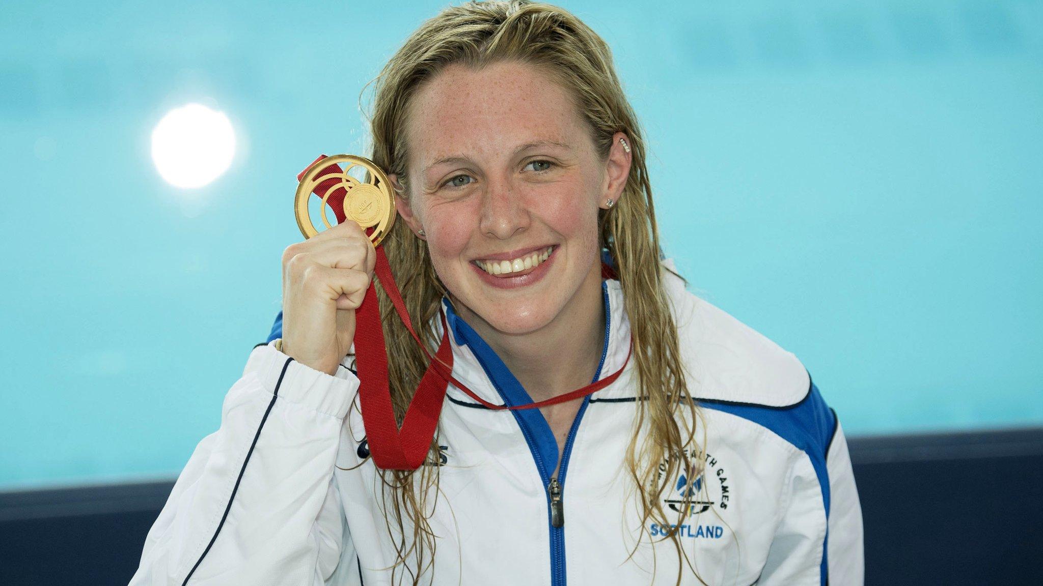 Hanah Miley shows off her 400m individual medley gold medal