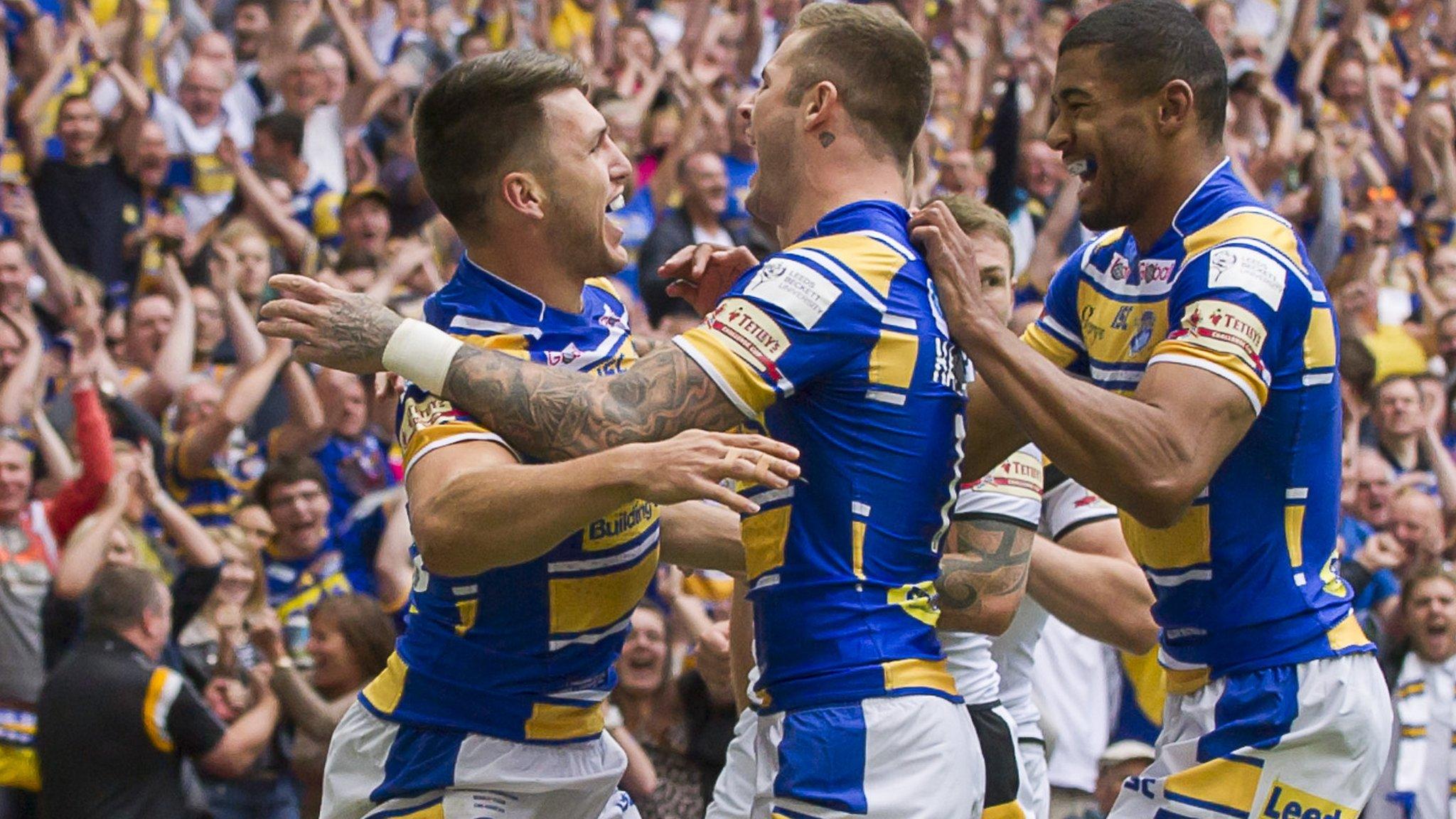 Tom Briscoe celebrates with team-mates after scoring Leeds' opening try