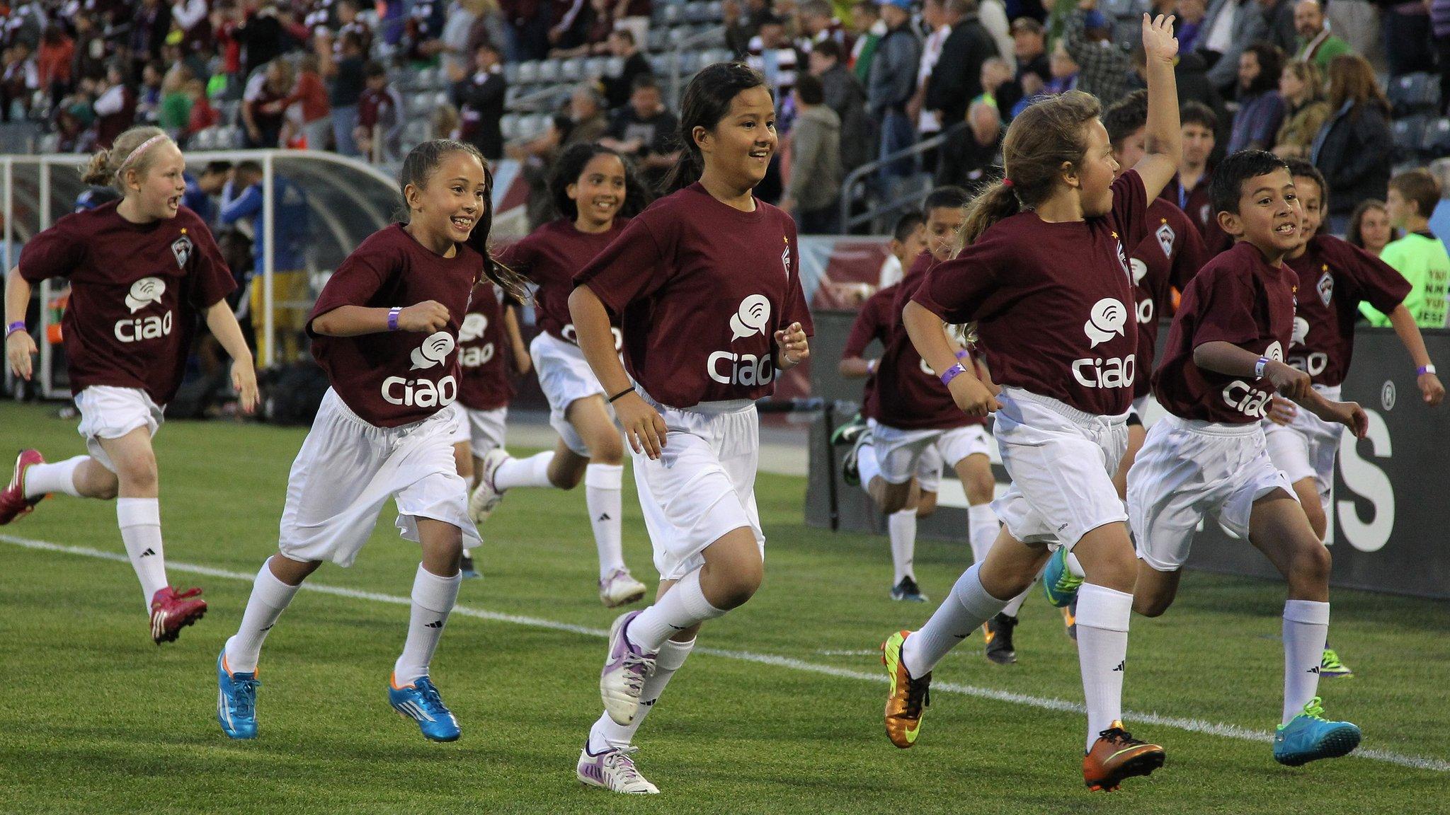 Young Colorado Rapids supporters take the field as the Rapids face the the Montreal Impact at Dick's Sporting Goods Park in Commerce City, Colorado 24 May 2014