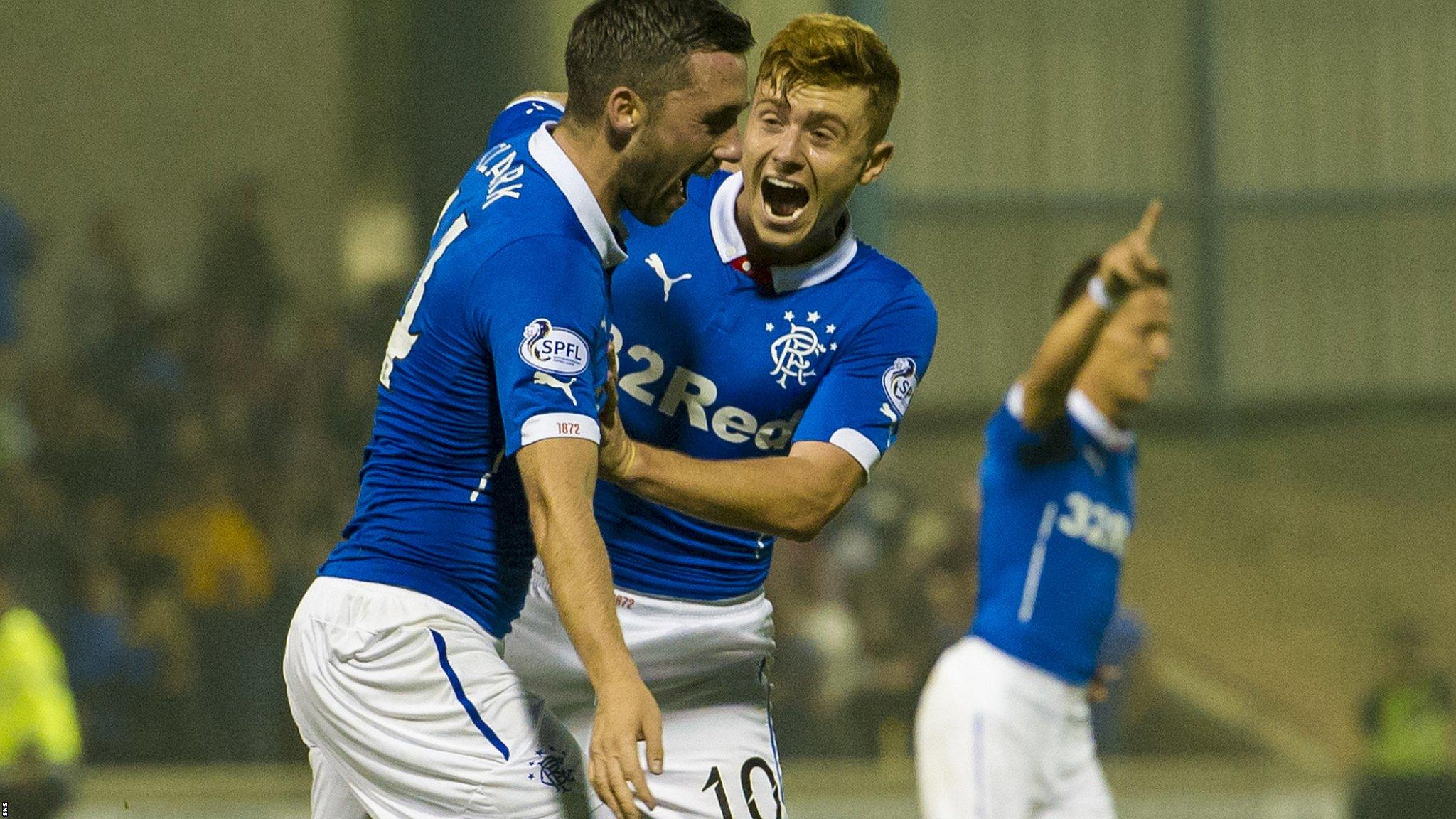 Nicky Clark celebrates his opener with Lewis Macleod