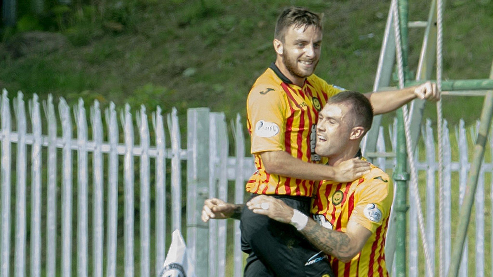 Steven Lawless celebrates his goal with Jordan McMillan