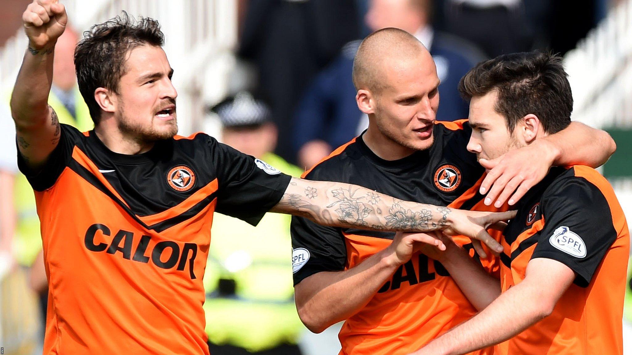 Dundee United players celebrate their third goal