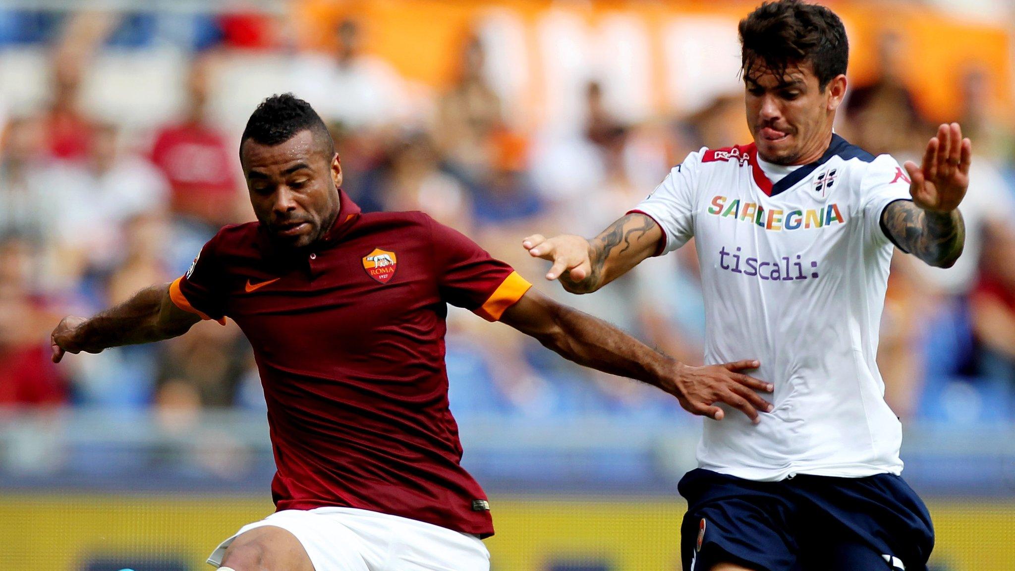 Roma's Ashley Cole in action against Luca Rossettini of Cagliari