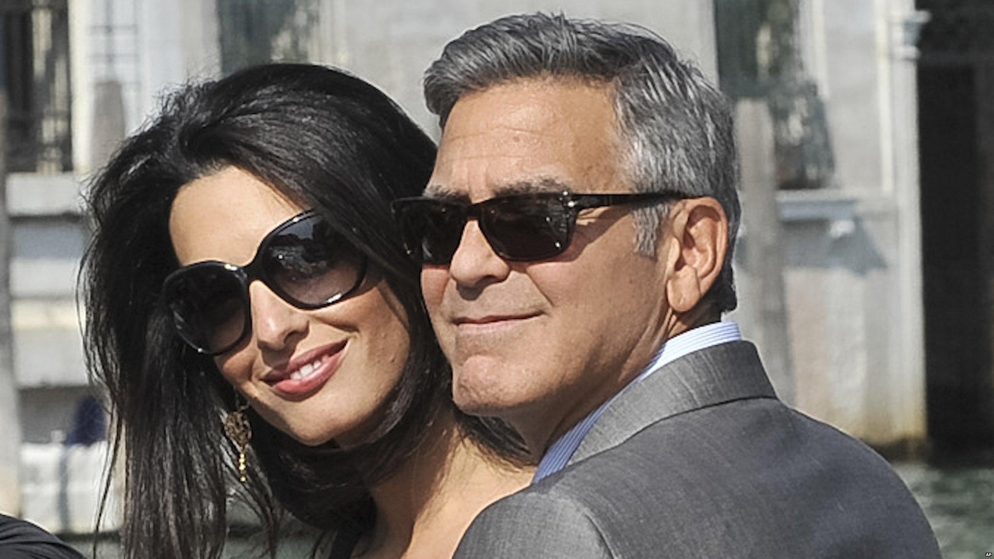 George Clooney and his fiancee Amal Alamuddin arrive in Venice