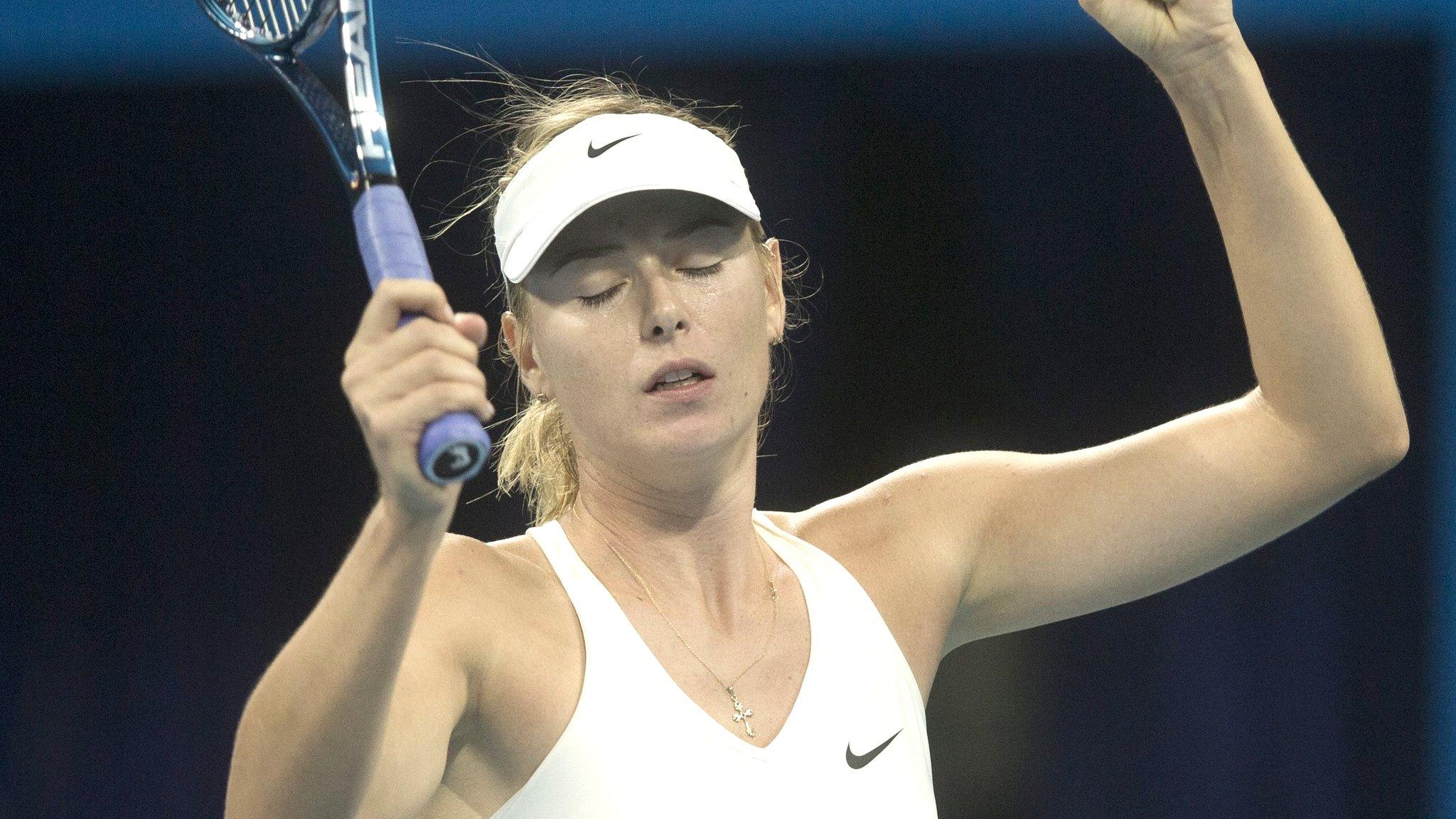 Maria Sharpova shows her relief after securing victory over Ana Ivanovic