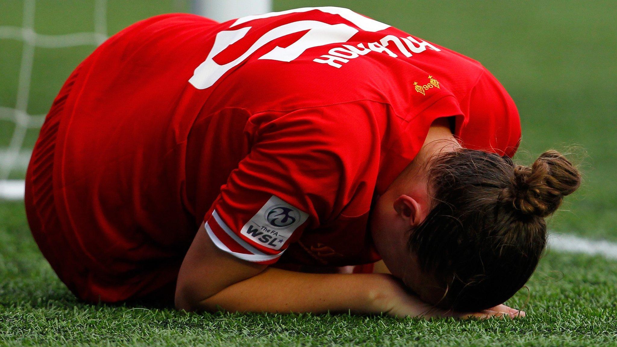 Jess Holbrook of Liverpool lays injured on the pitch