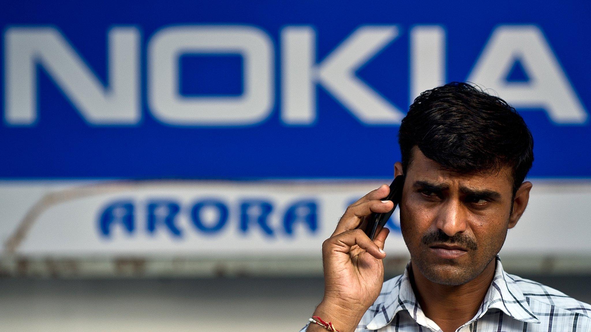 A man outside a Nokia store in India