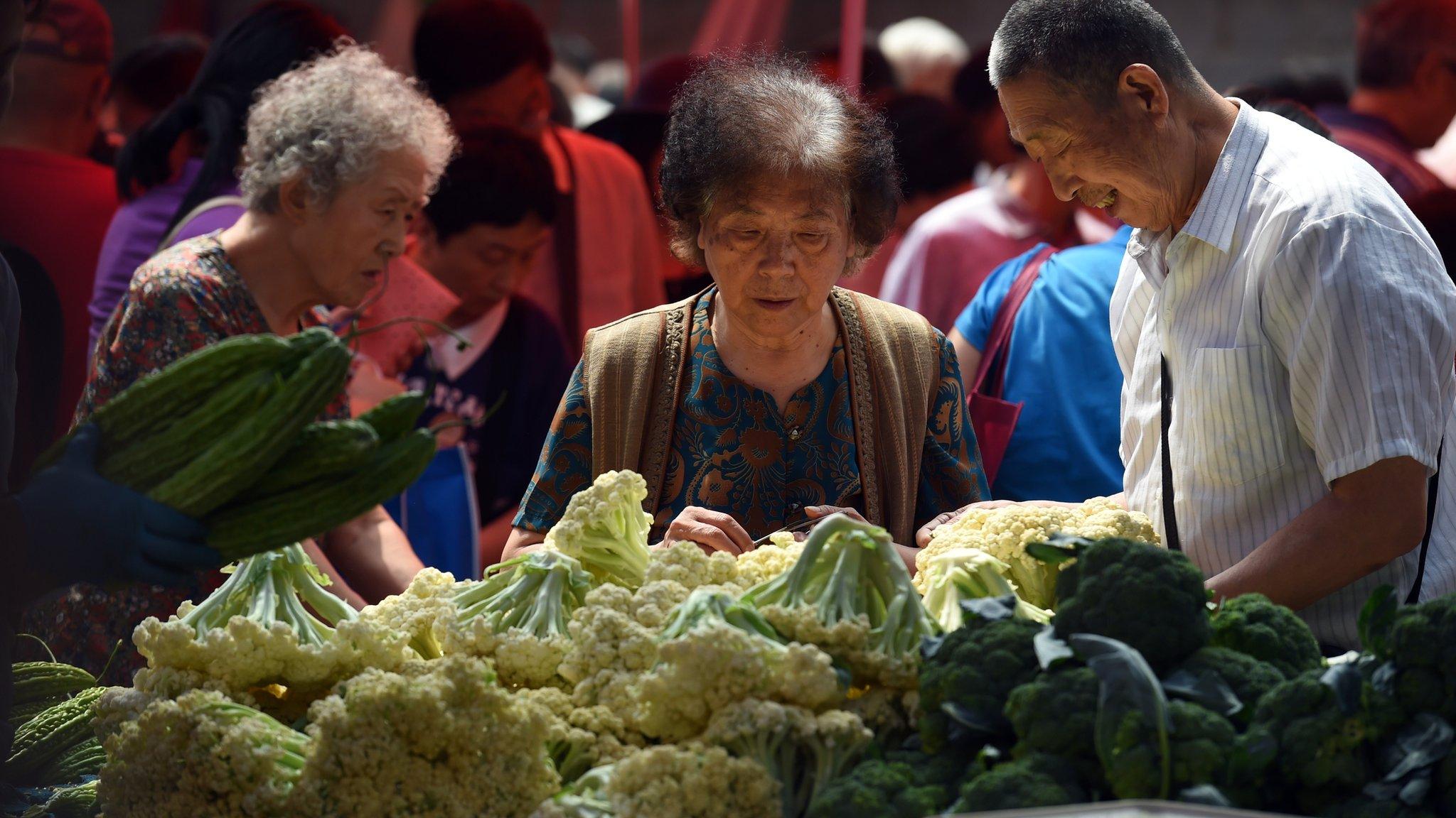 People buying vegetables in Beijing