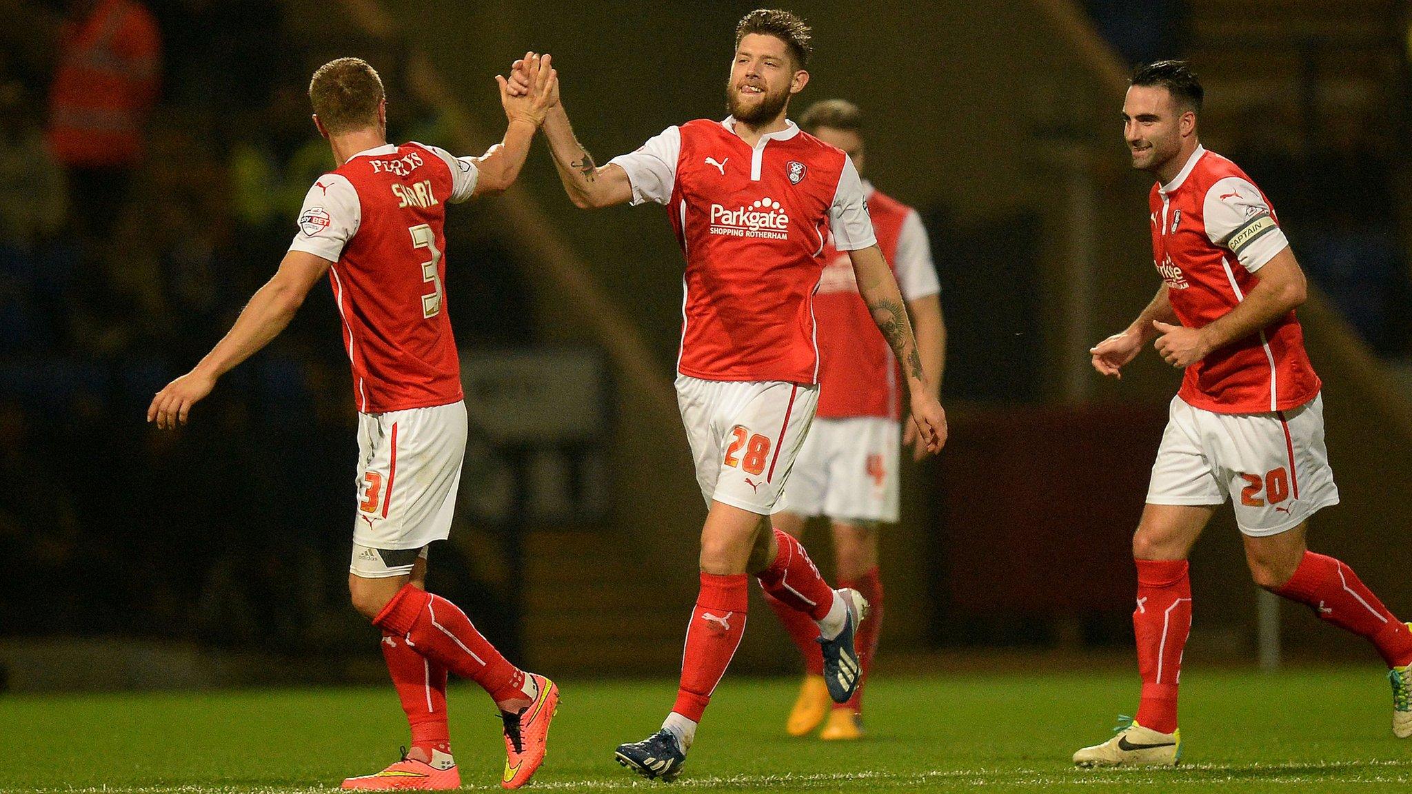 Rotherham United players celebrate their opening goal against Bolton Wanderers