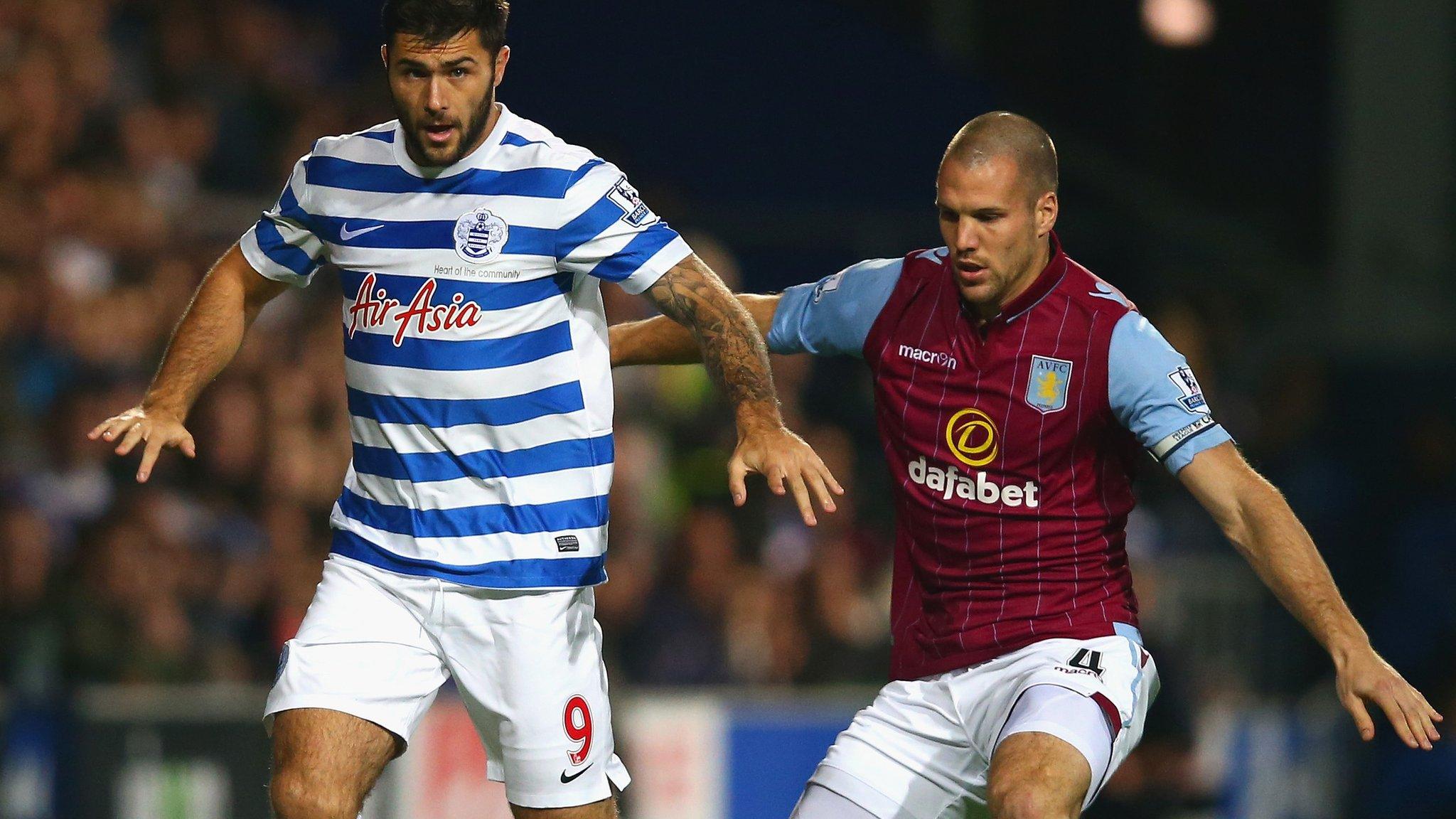 QPR's Charlie Austin and Aston Villa defender Ron Vlaar