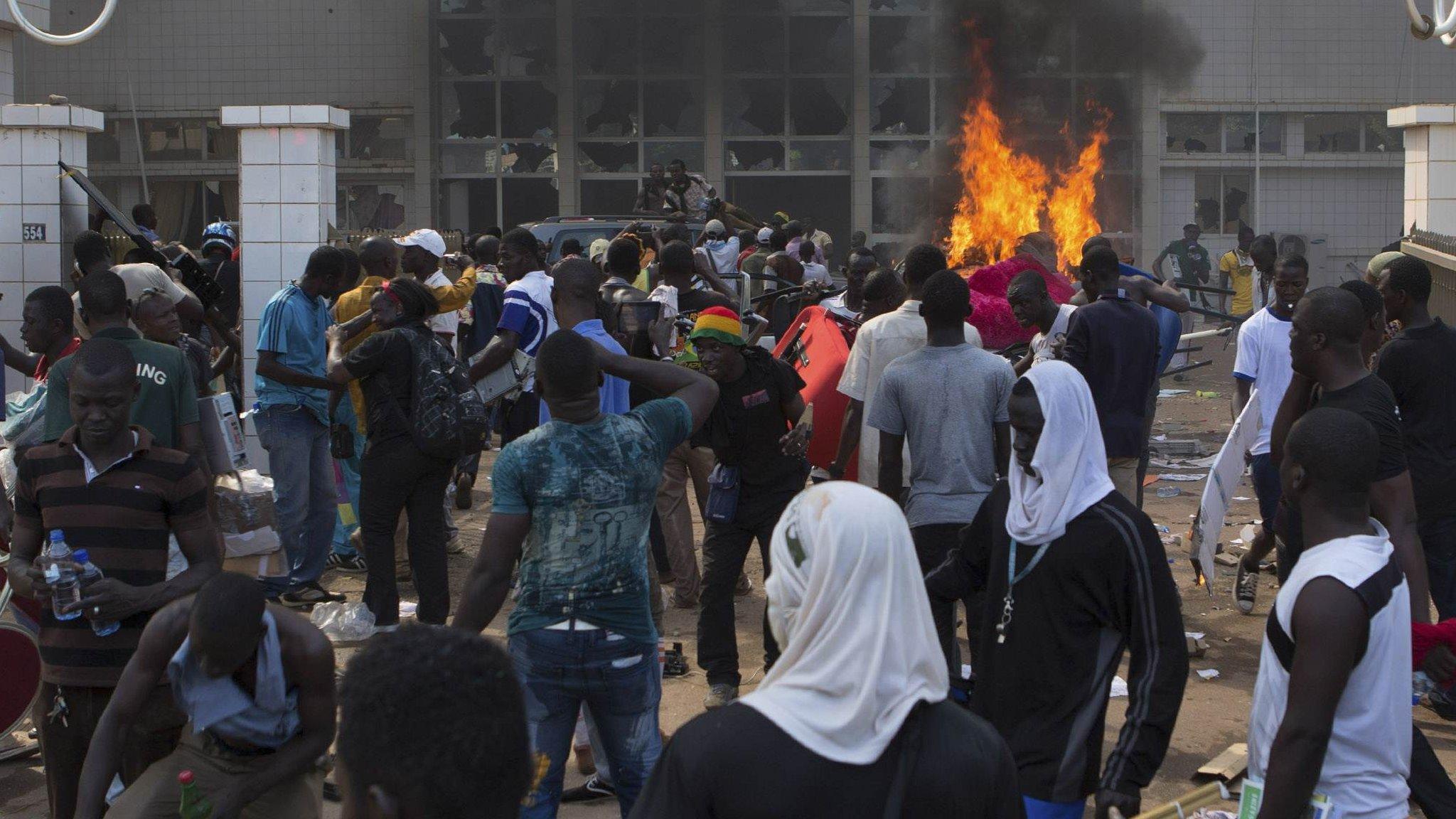 Anti-government protesters set fire to the parliament building in Ouagadougou, capital of Burkina Faso, 30 October 2014