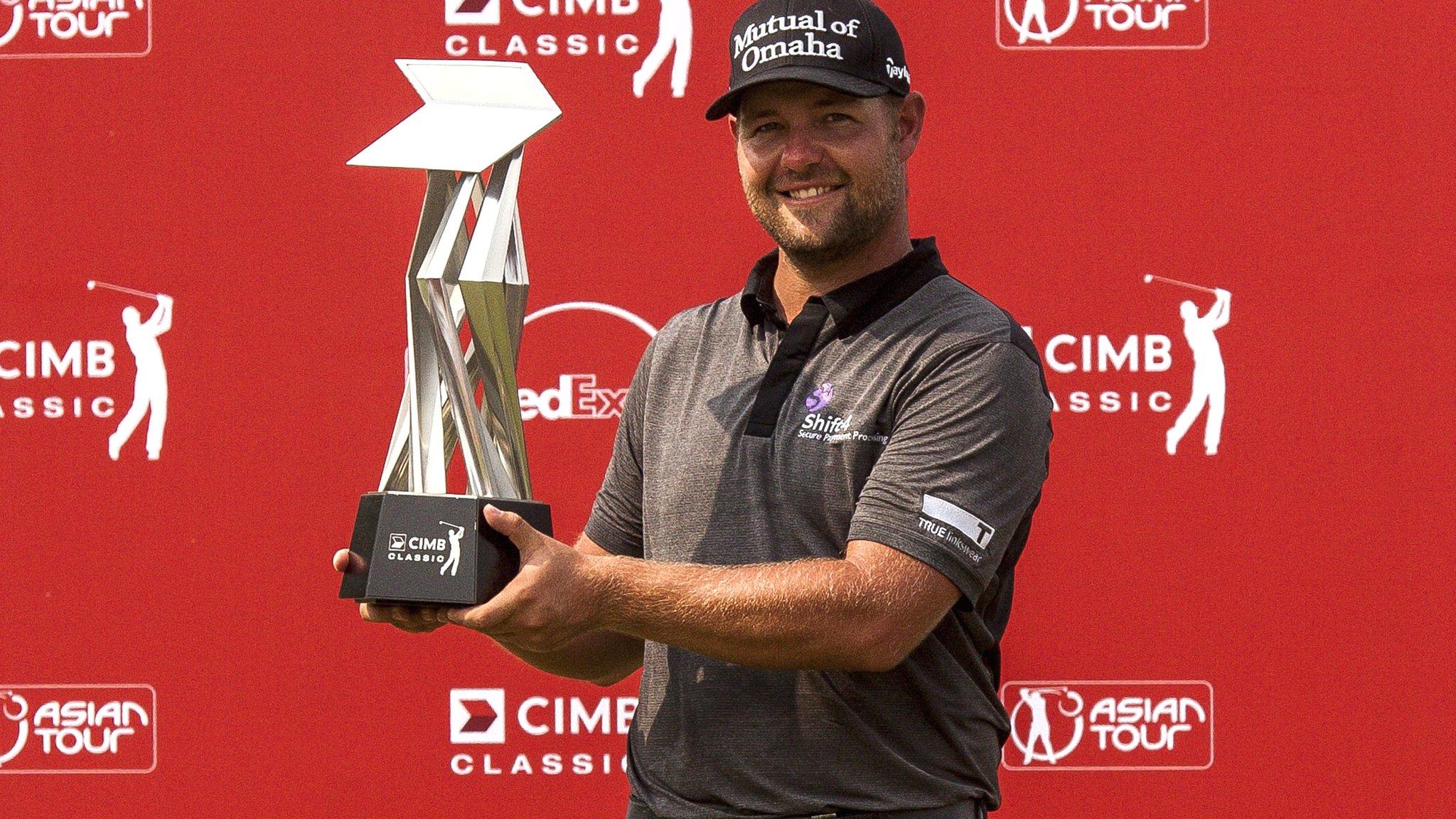 Ryan Moore with the CIMB Classic trophy