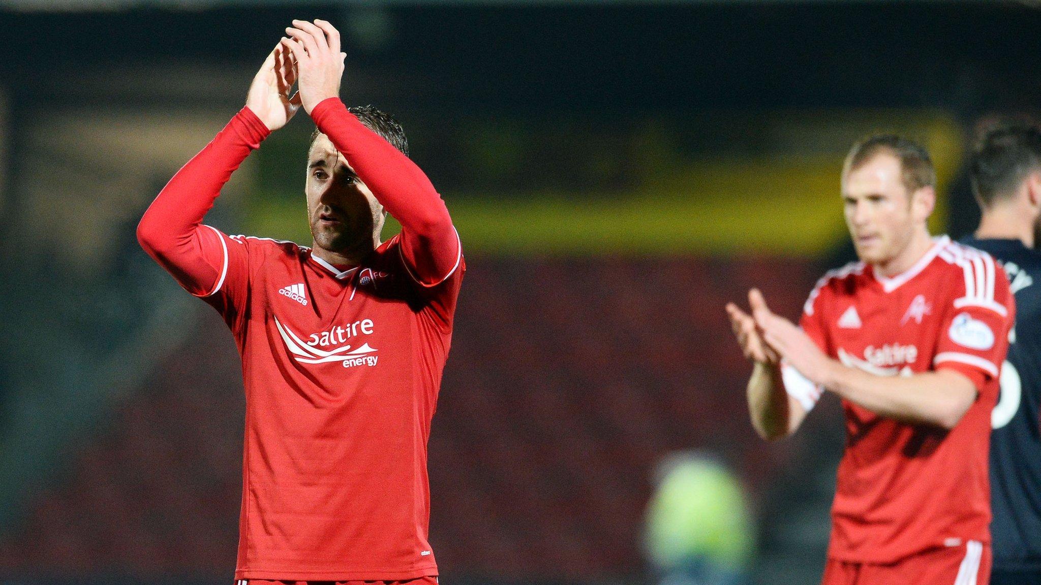 Niall McGinn hails the Aberdeen fans at full time