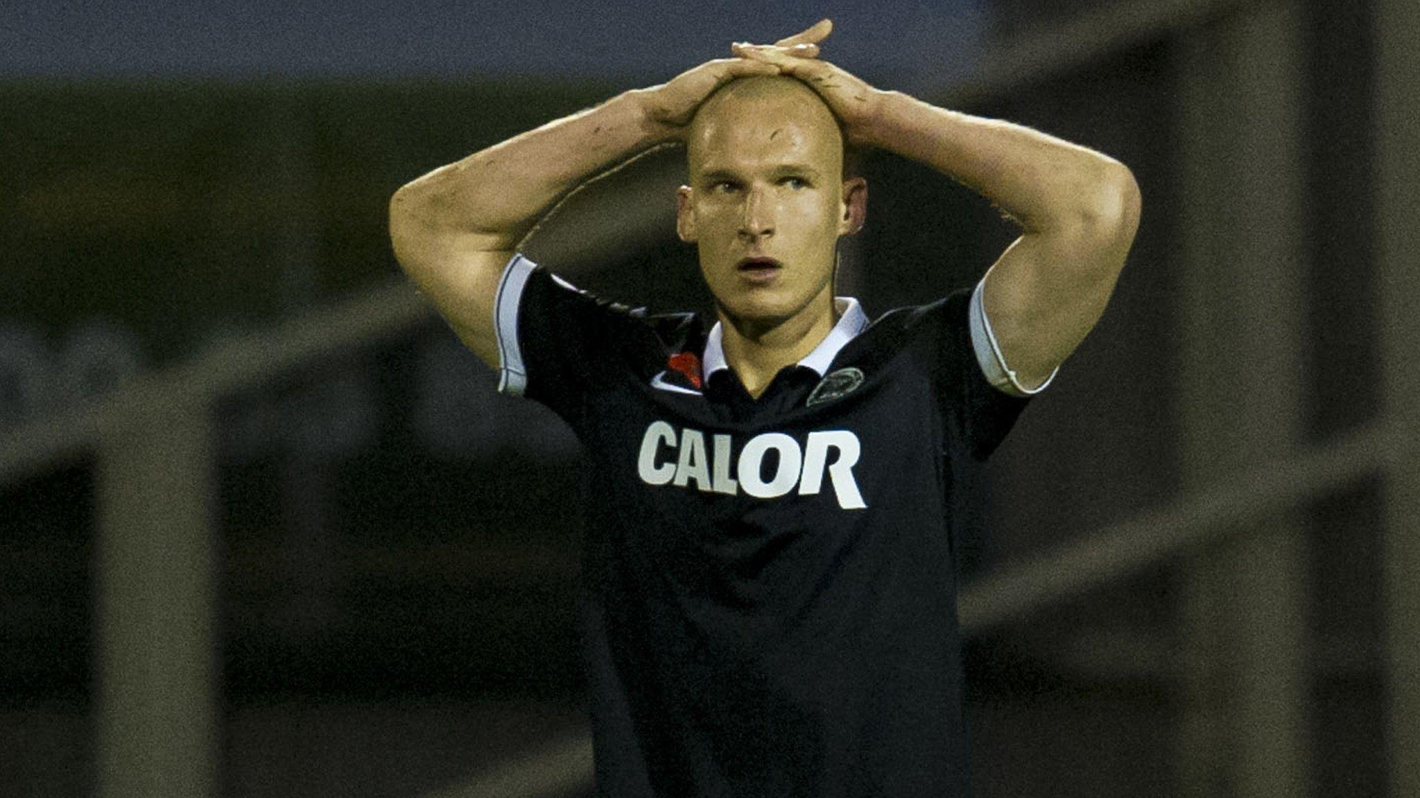 Dejection at full-time for Dundee Utd defender Jaroslaw Fojut