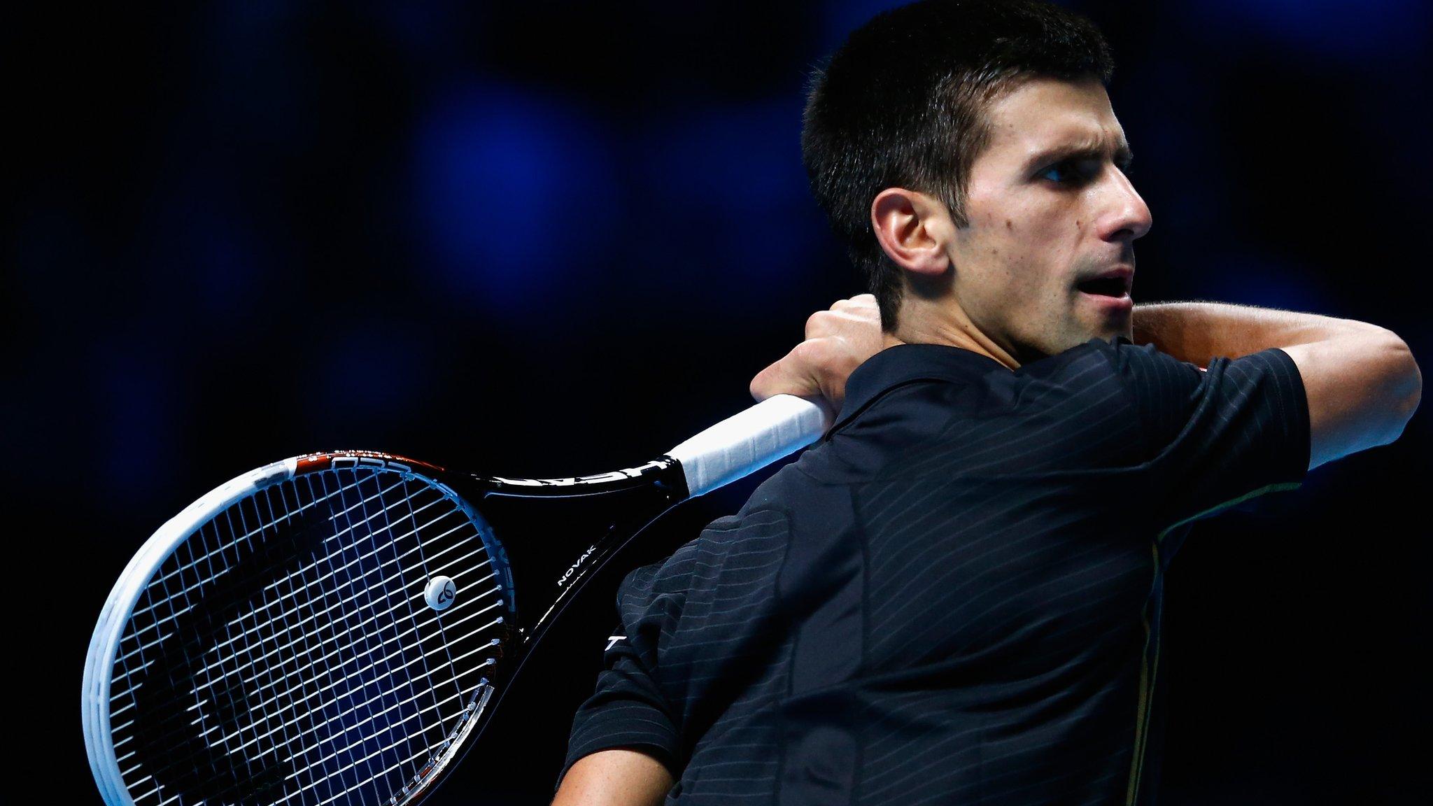 Novak Djokovic celebrates beating Marin Cilic at the ATP World Tour Finals in London