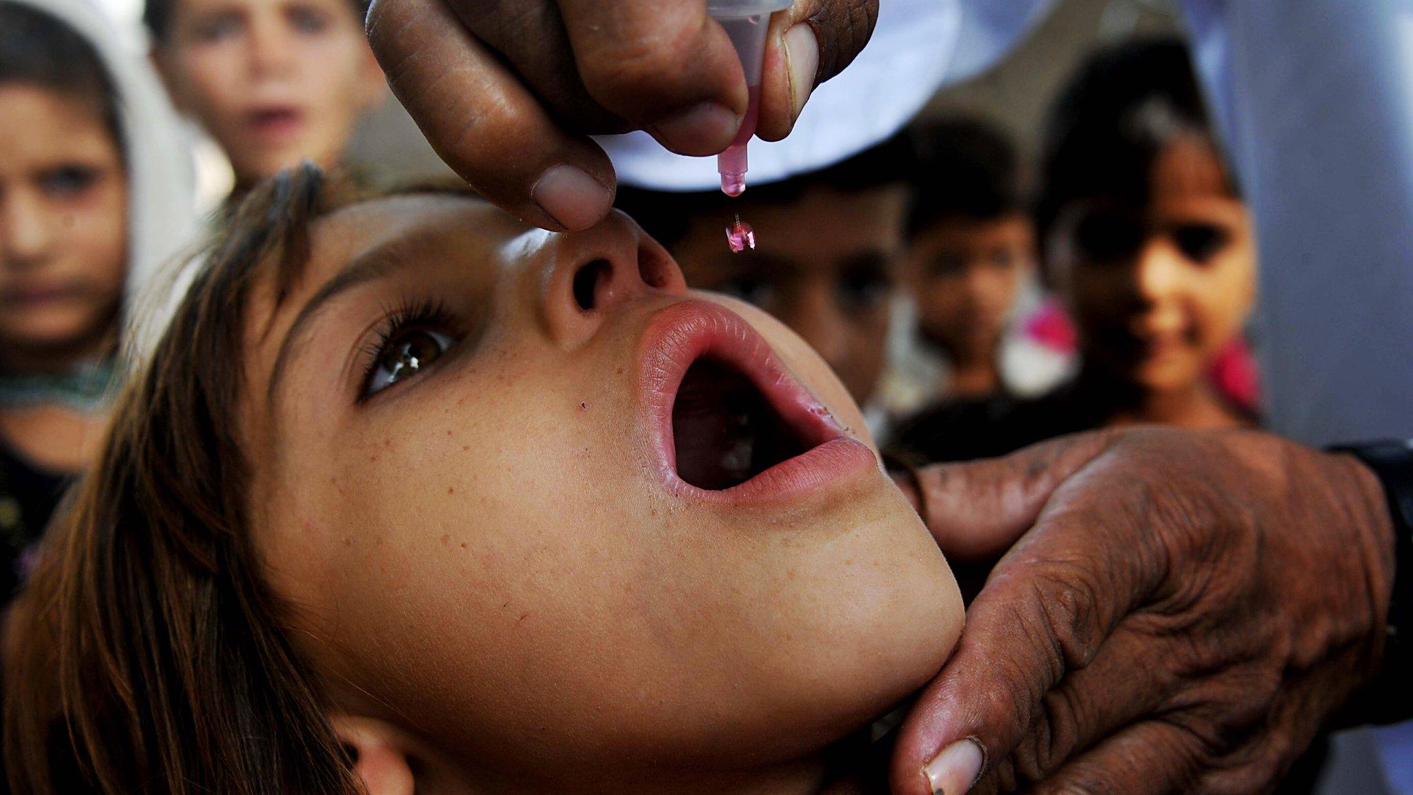 Girl being vaccinated