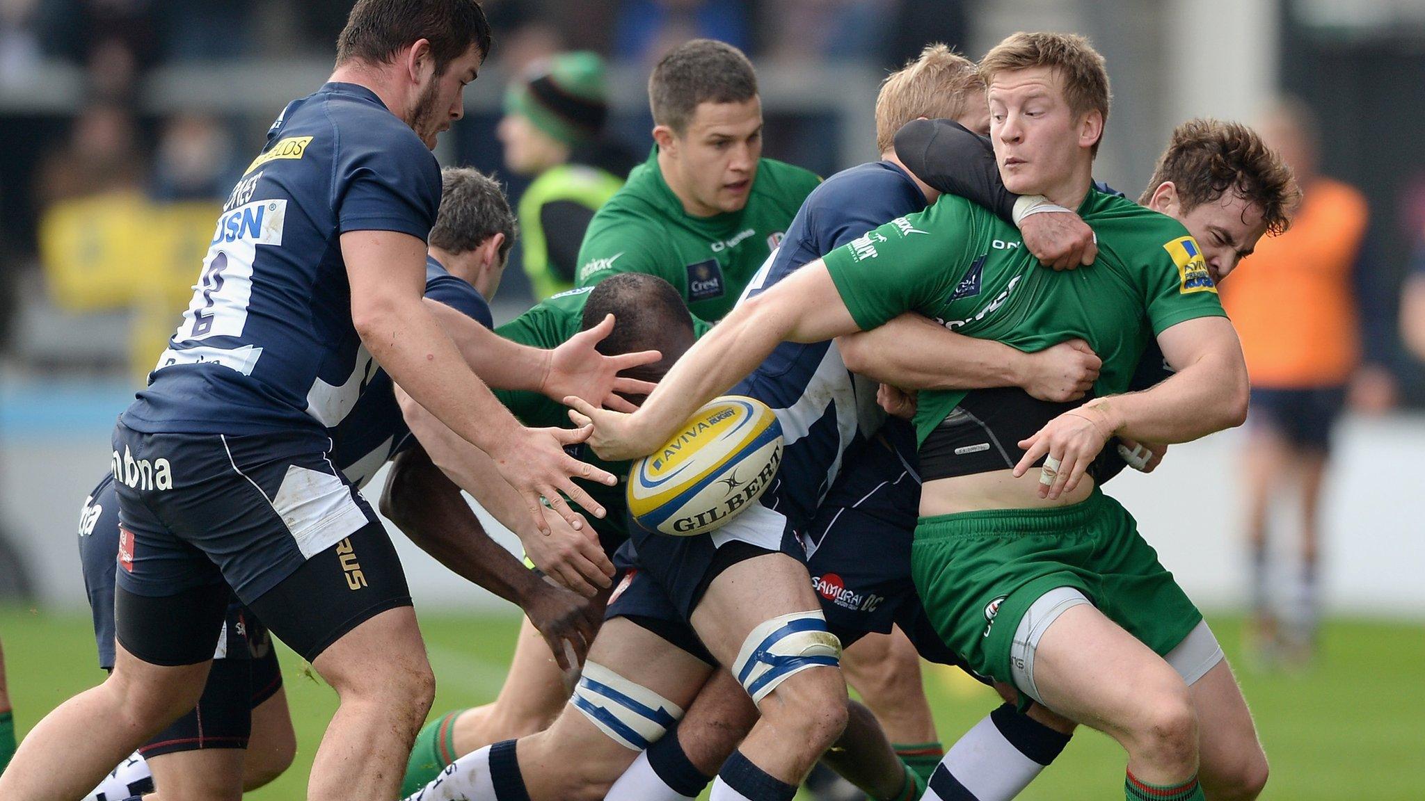 London Irish's Eoin Griffin tacked as he looks to offload against Sale