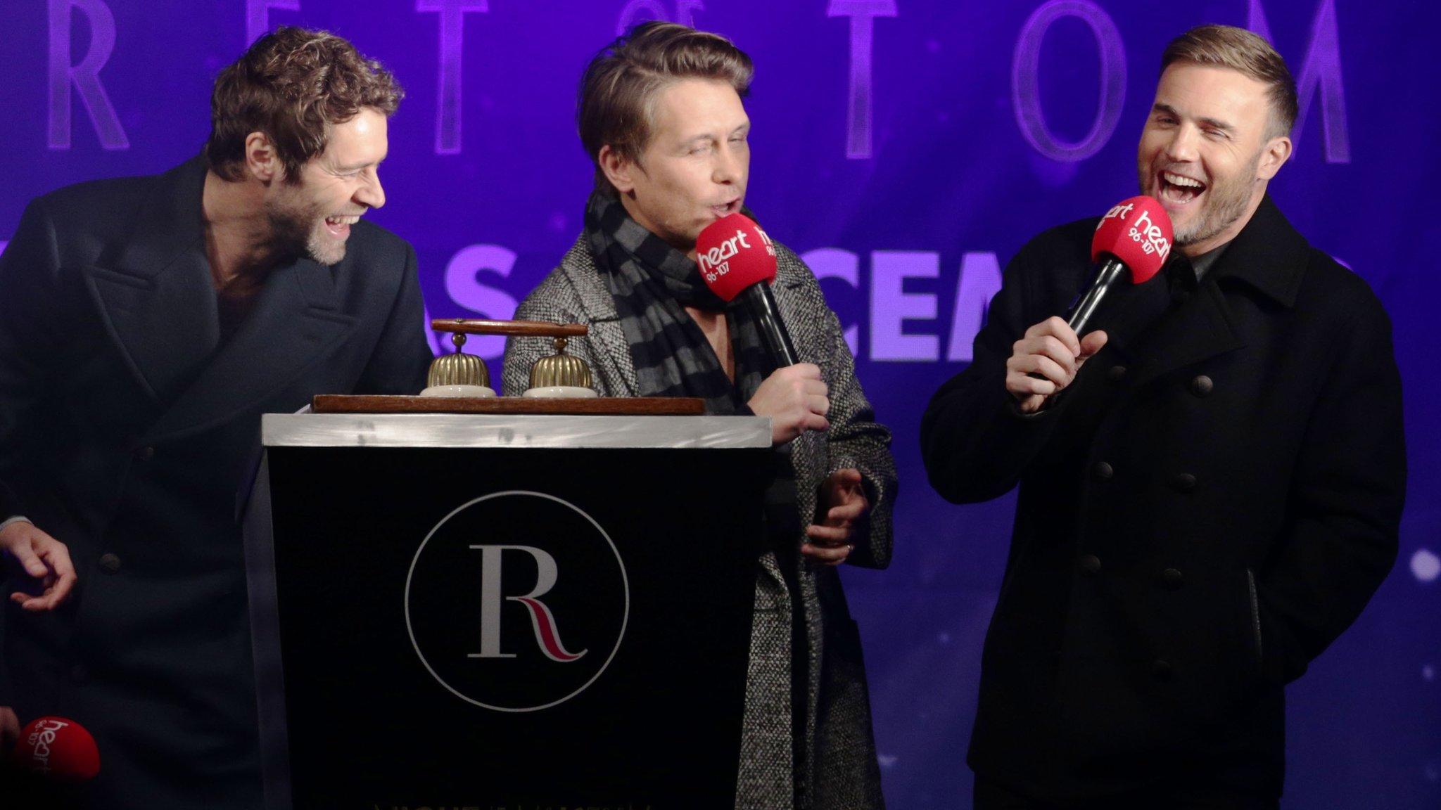 Gary Barlow (right), Howard Donald (left) and Mark Owen as the Regent Street Christmas lights were switched on