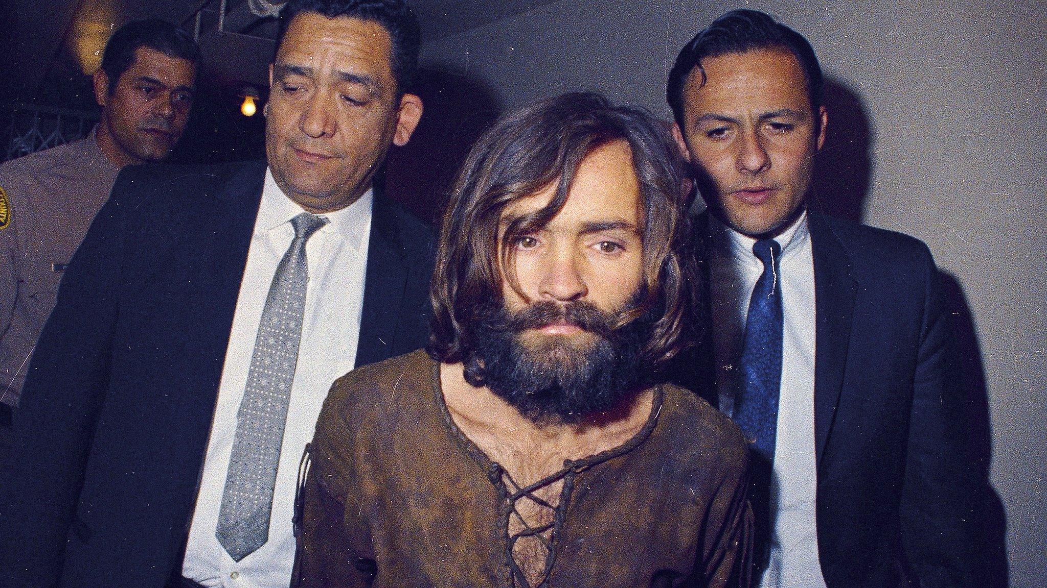 Charles Manson escorted to his arraignment on conspiracy-murder charges in connection with the Sharon Tate murder case, 1969, Los Angeles