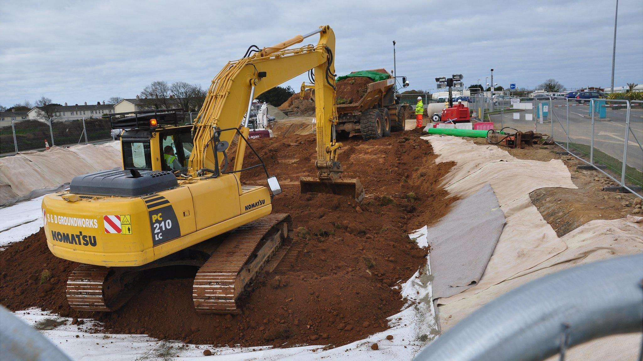 Soil contaminated with PFOS being buried in a bund by the entrance to Guernsey Airport