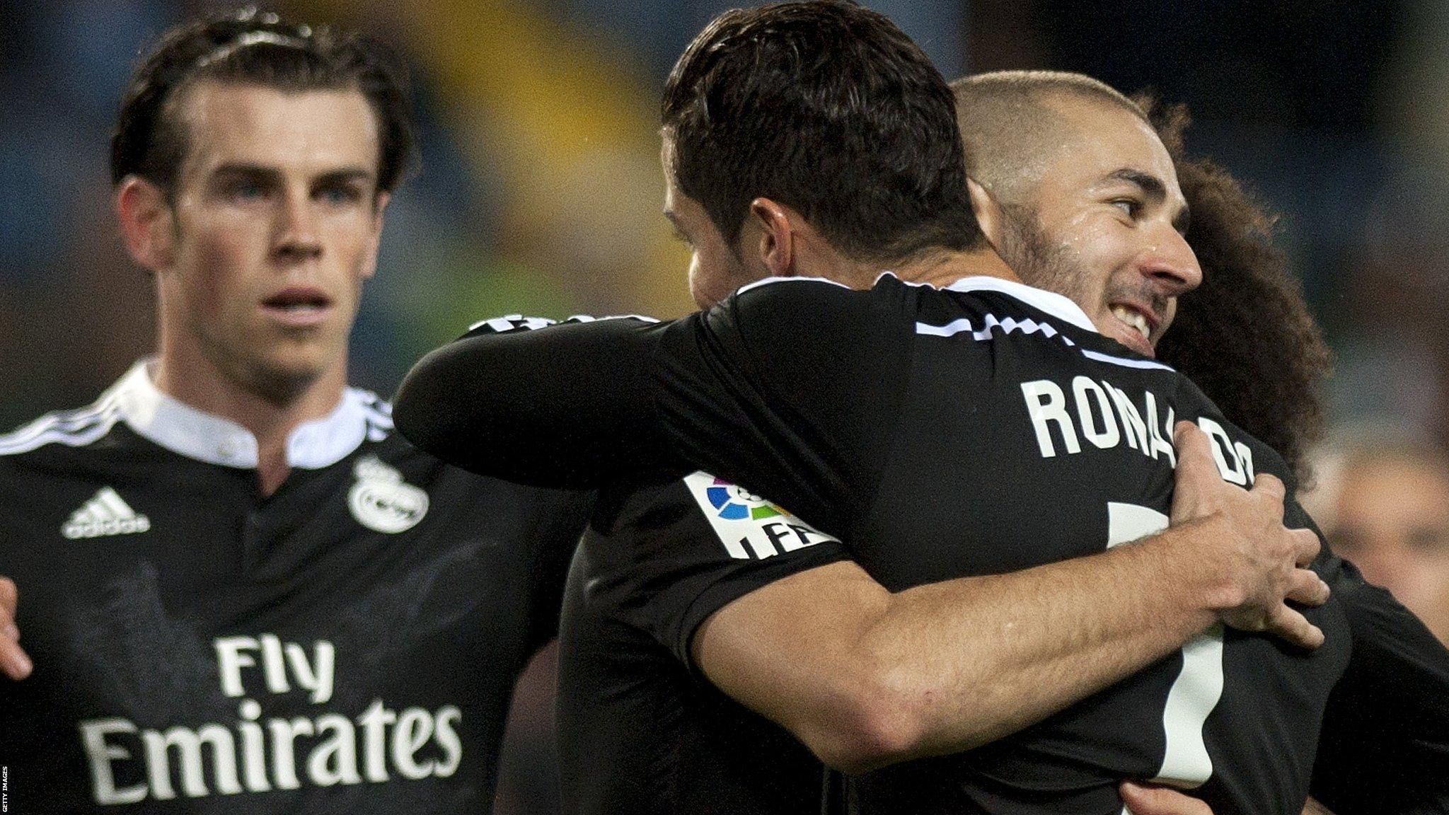 Real Madrid striker Karim Benzema celebrates his goal against Malaga