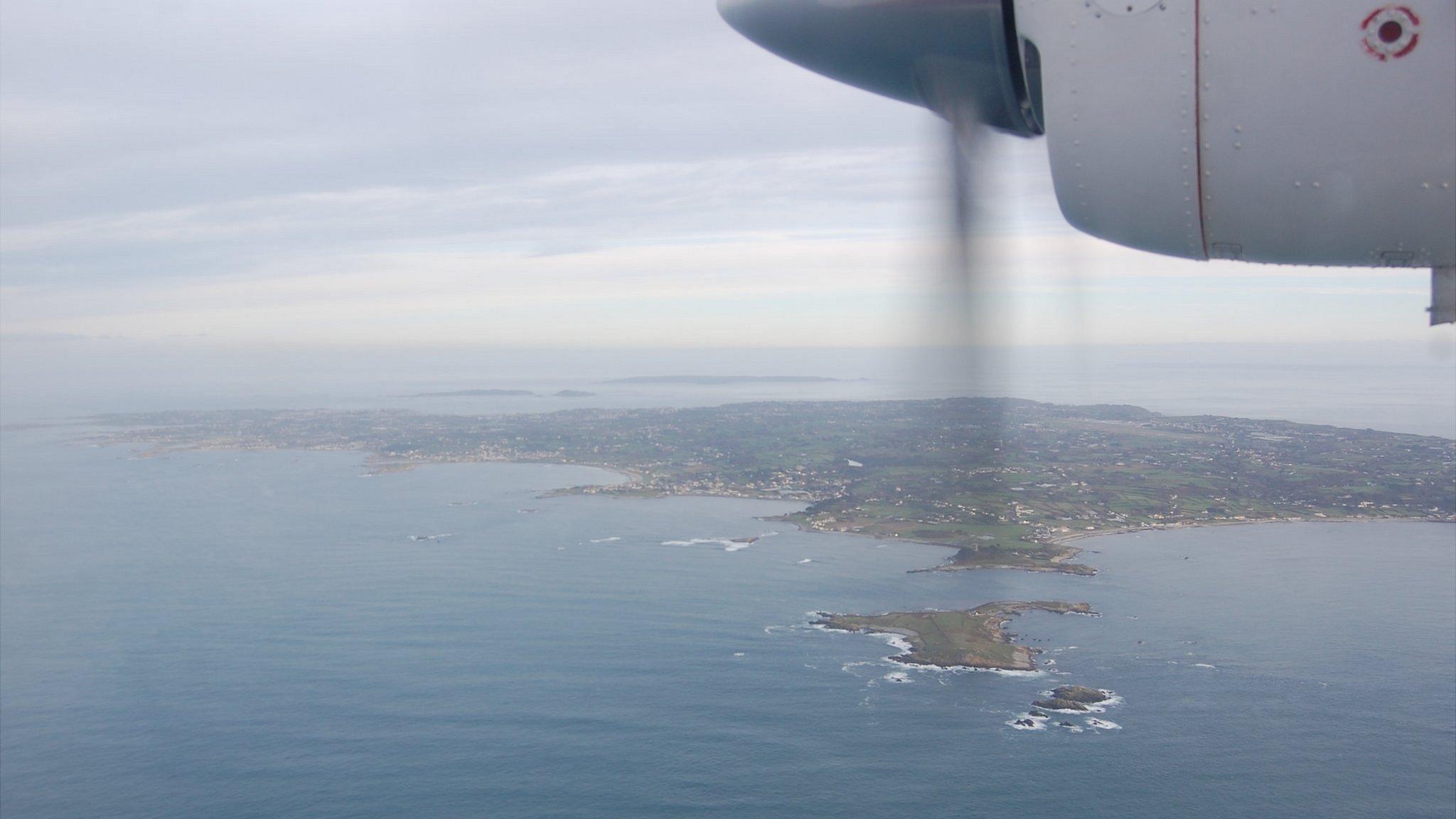 Guernsey seen from a plane with part of propeller in view