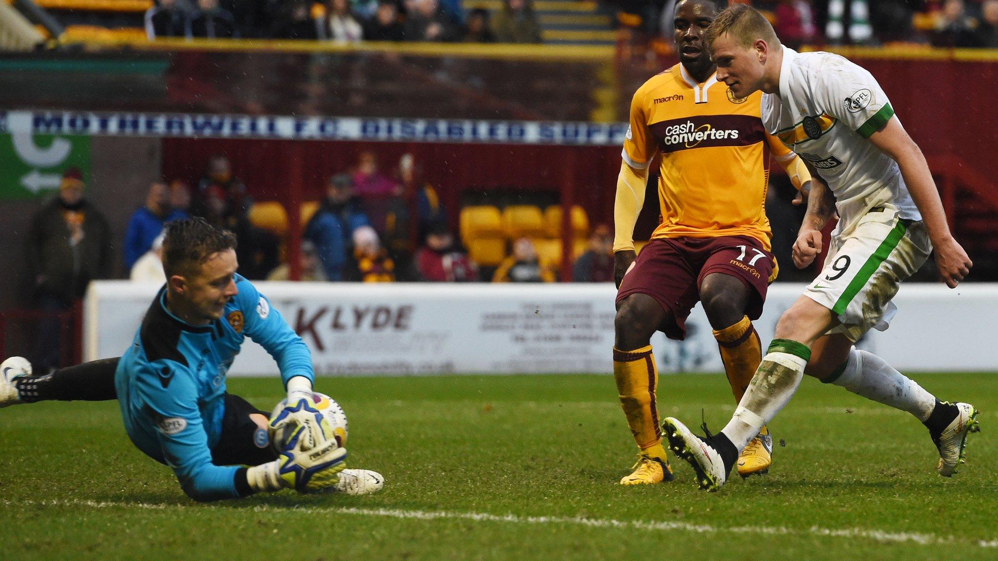 Motherwell goalkeeper Dan Twardzik makes a save following John Guidetti's shot