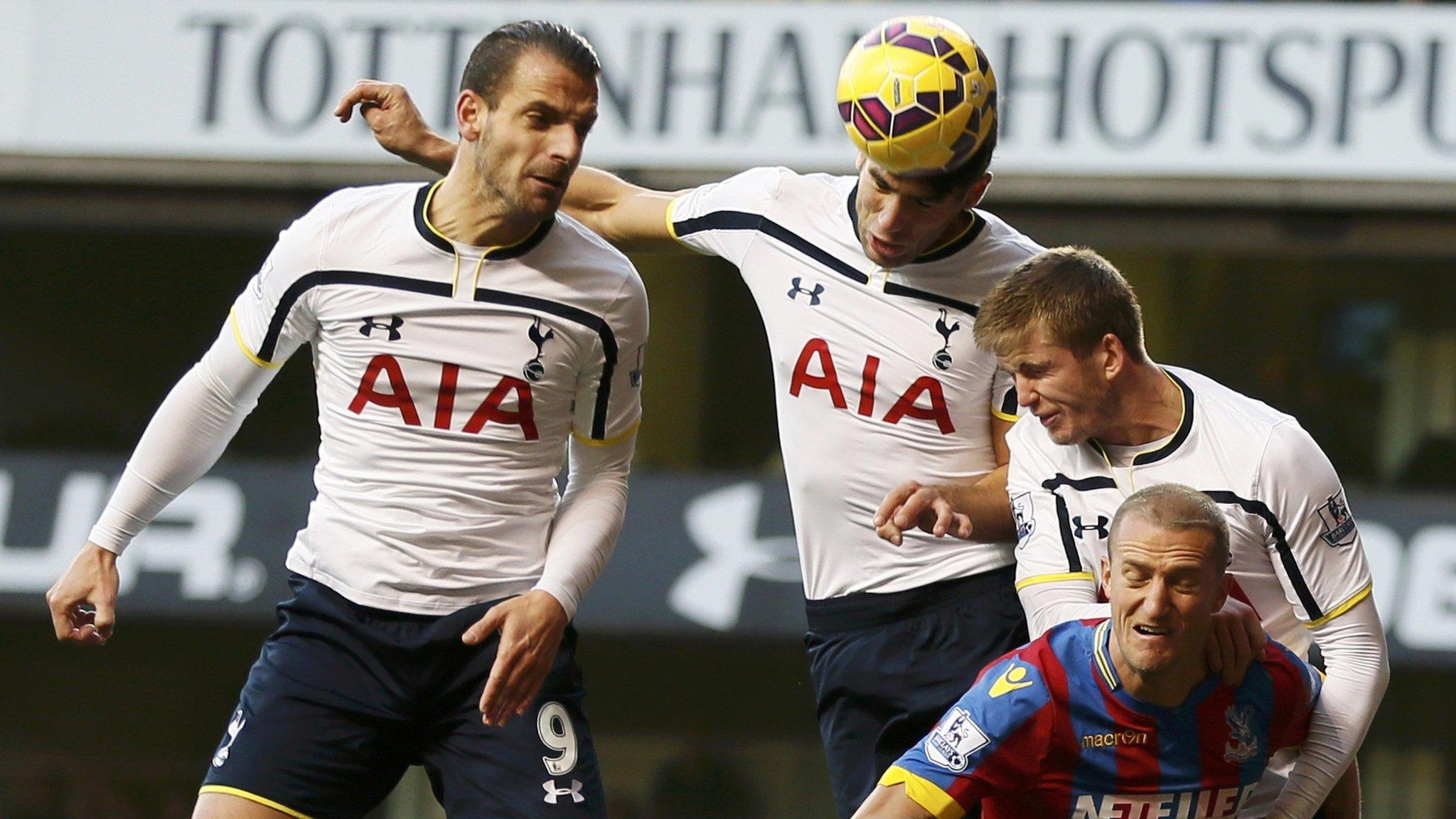 Three Tottenham players challenge with Palace defender Brede Hangeland