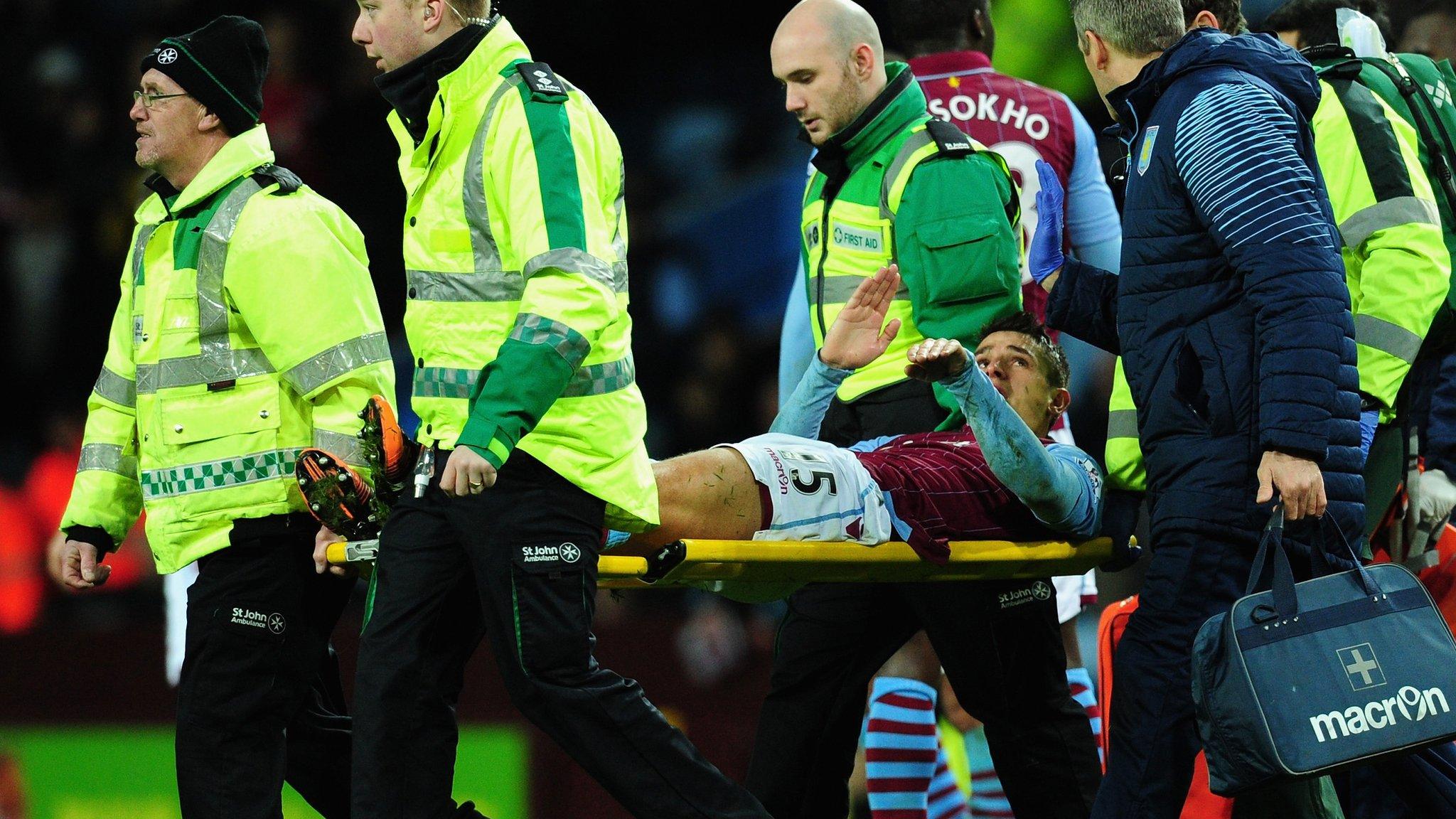 Ashley Westwood is stretchered off at Villa Park