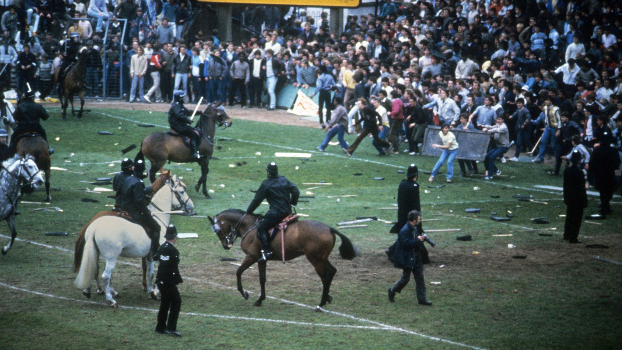 Football fans invade pitch at Birmingham v Leeds match on 11 May 1985