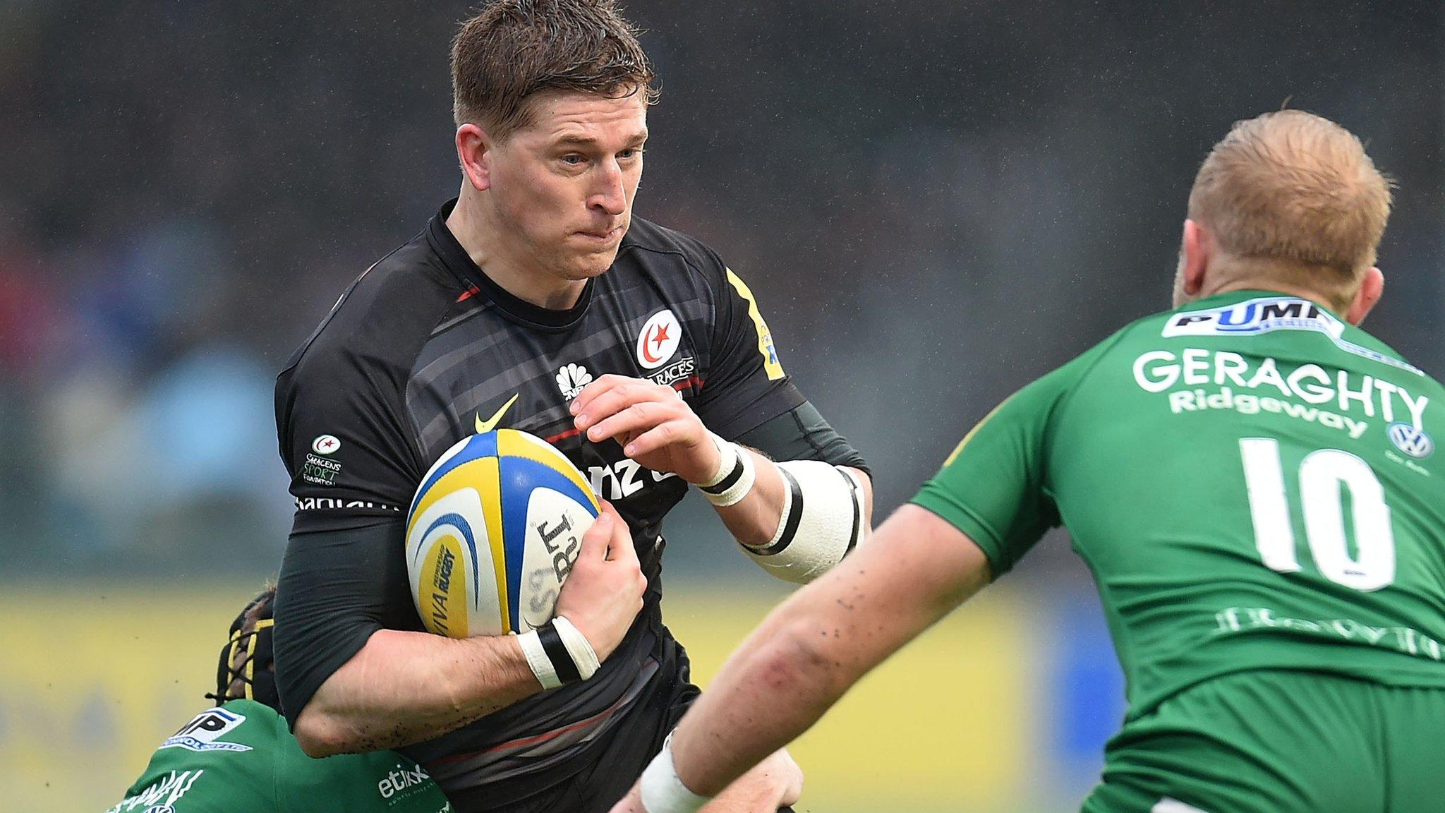 David Strettle trying to ride a tackle against London Irish