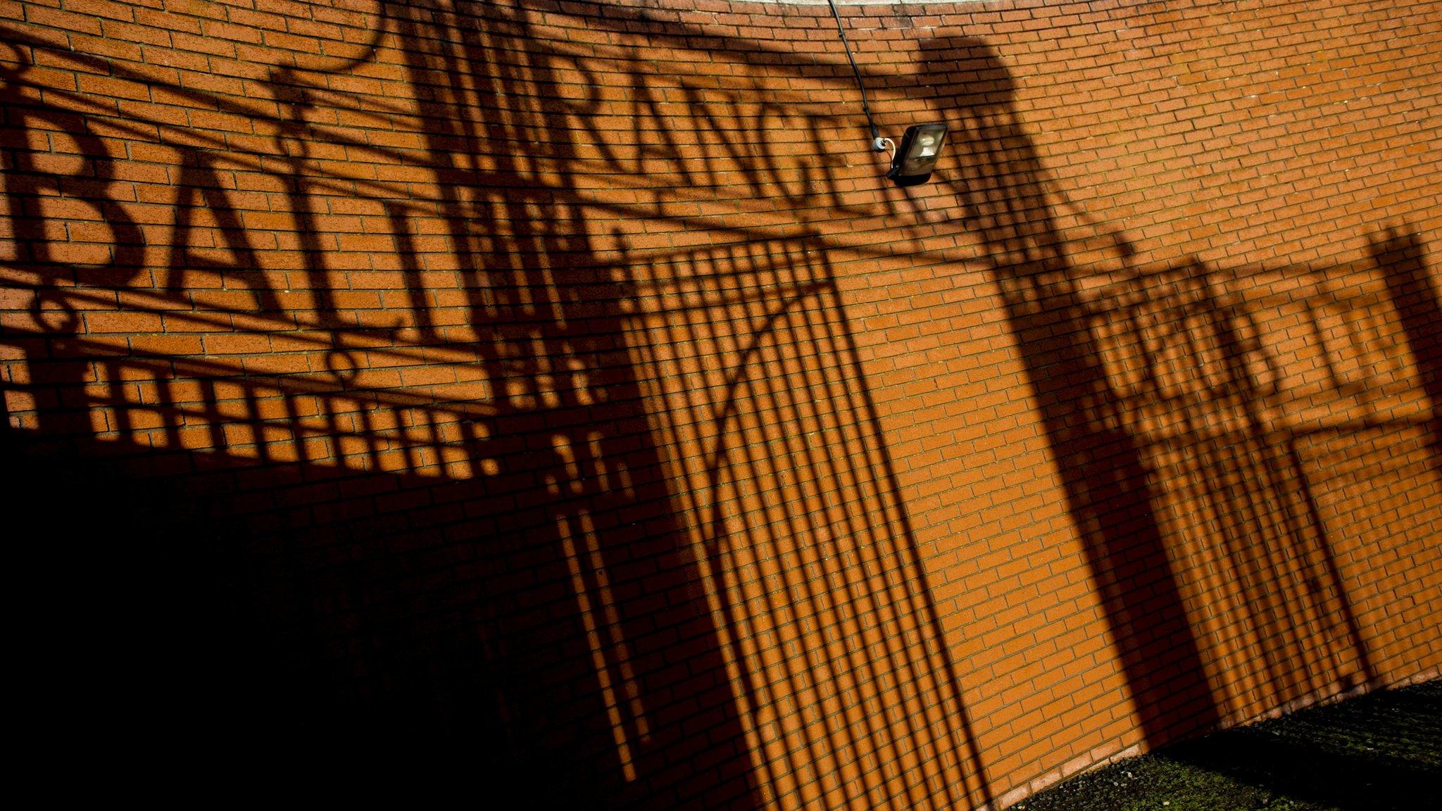 A shadow of the gates at Ibrox Stadium