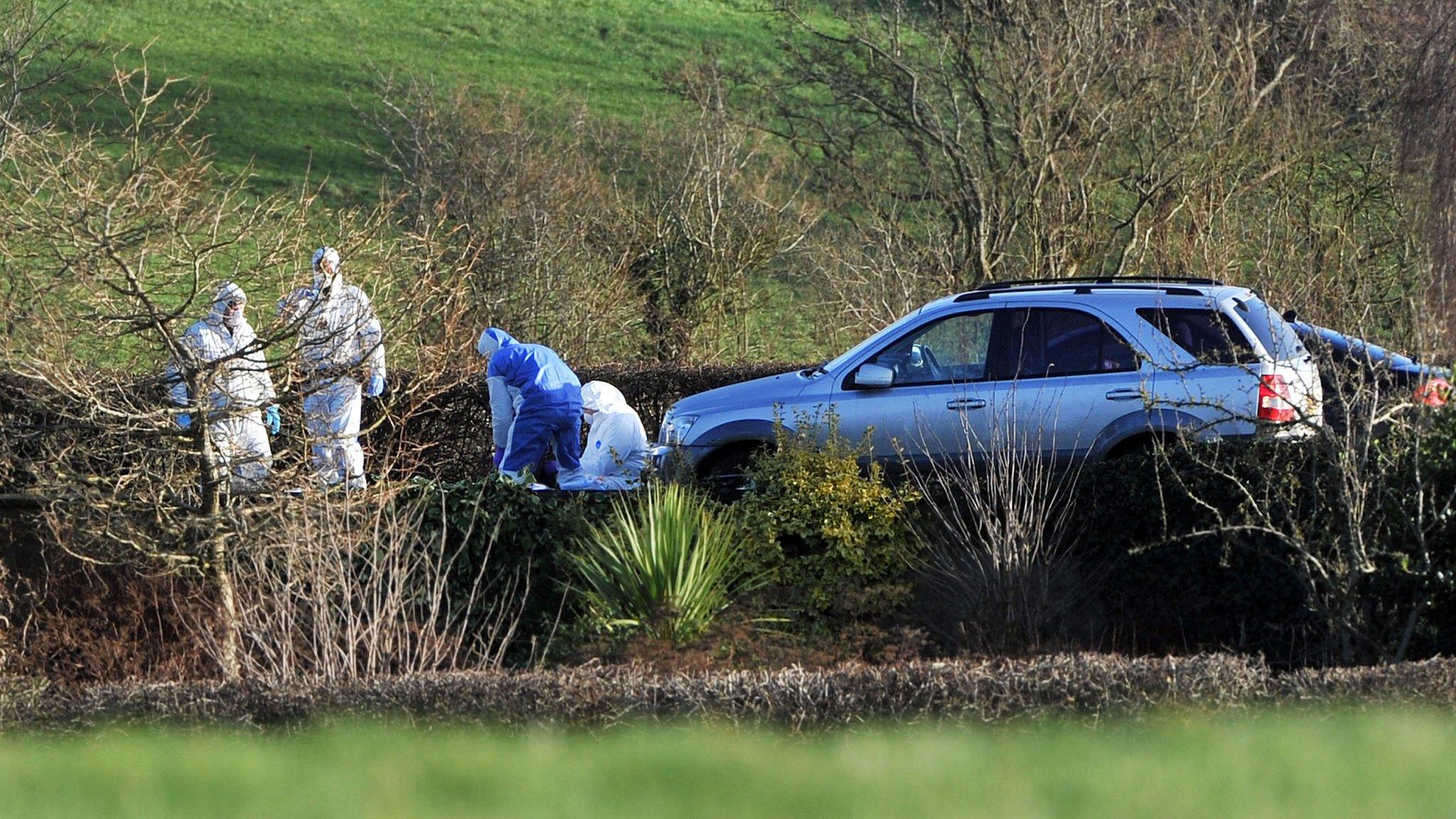 Forensic investigators at the scene of the murder