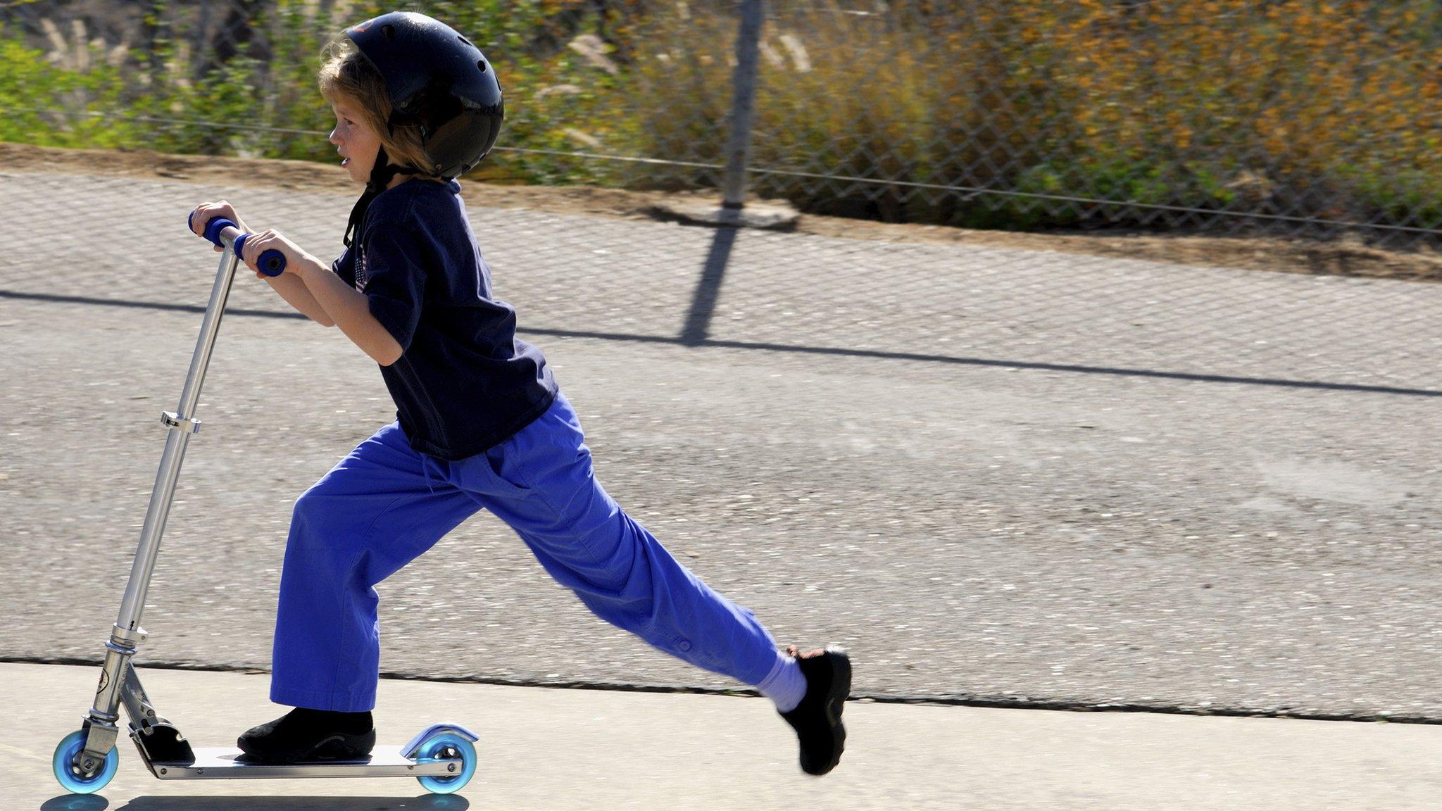 Child on scooter