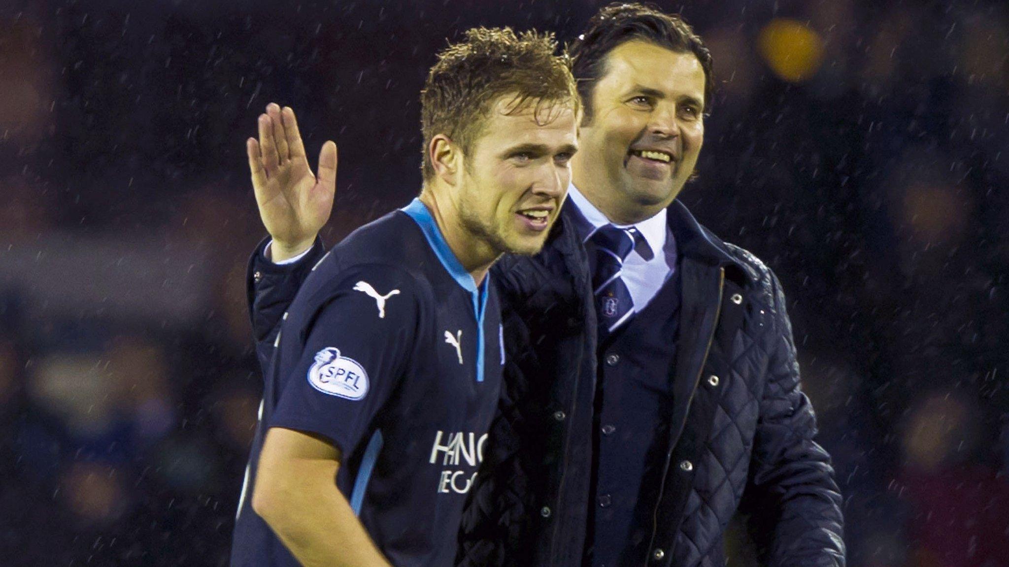 Dundee striker Greg Stewart is congratulated by manager Paul Hartley